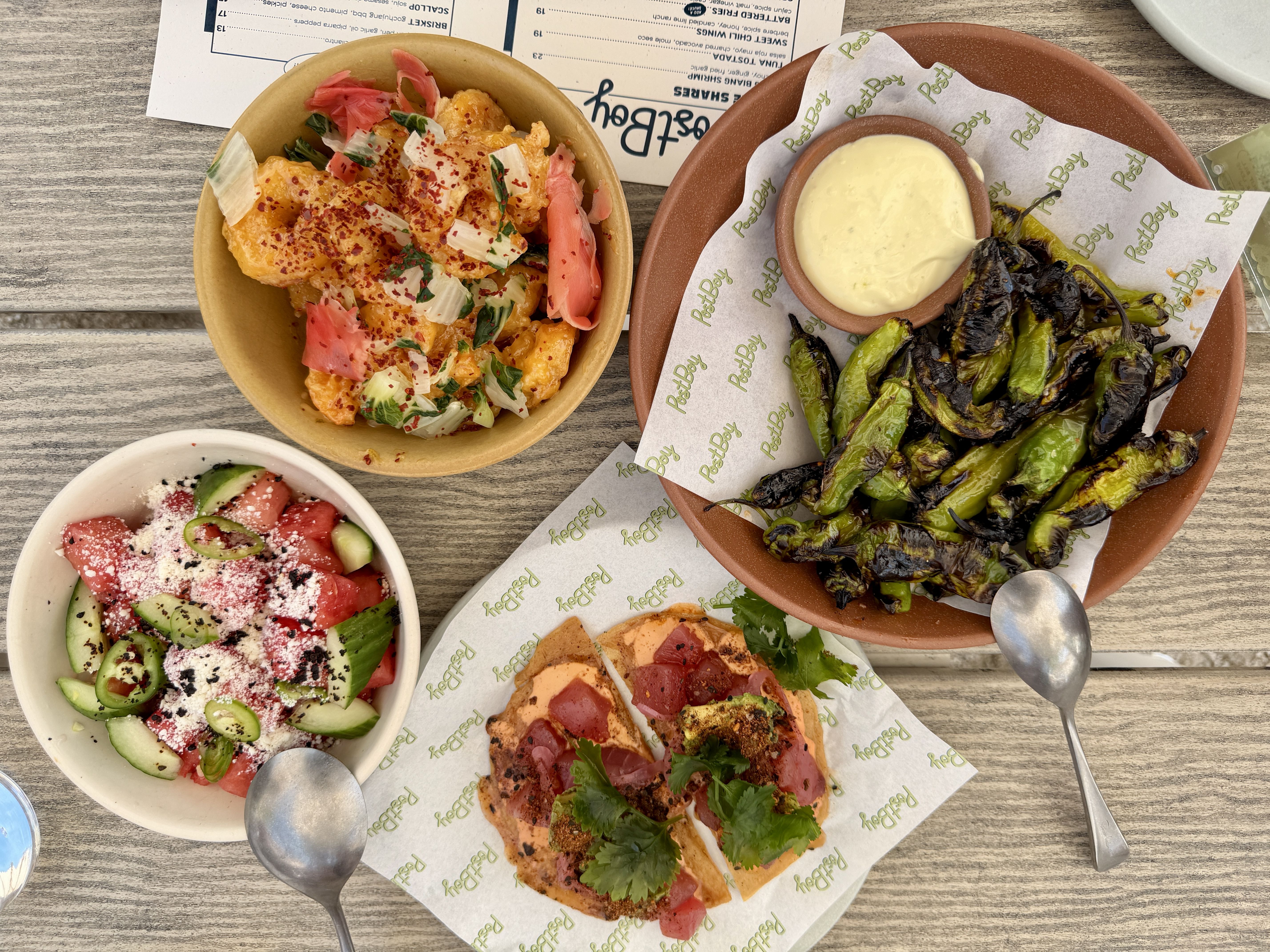 four dishes of food on the table
