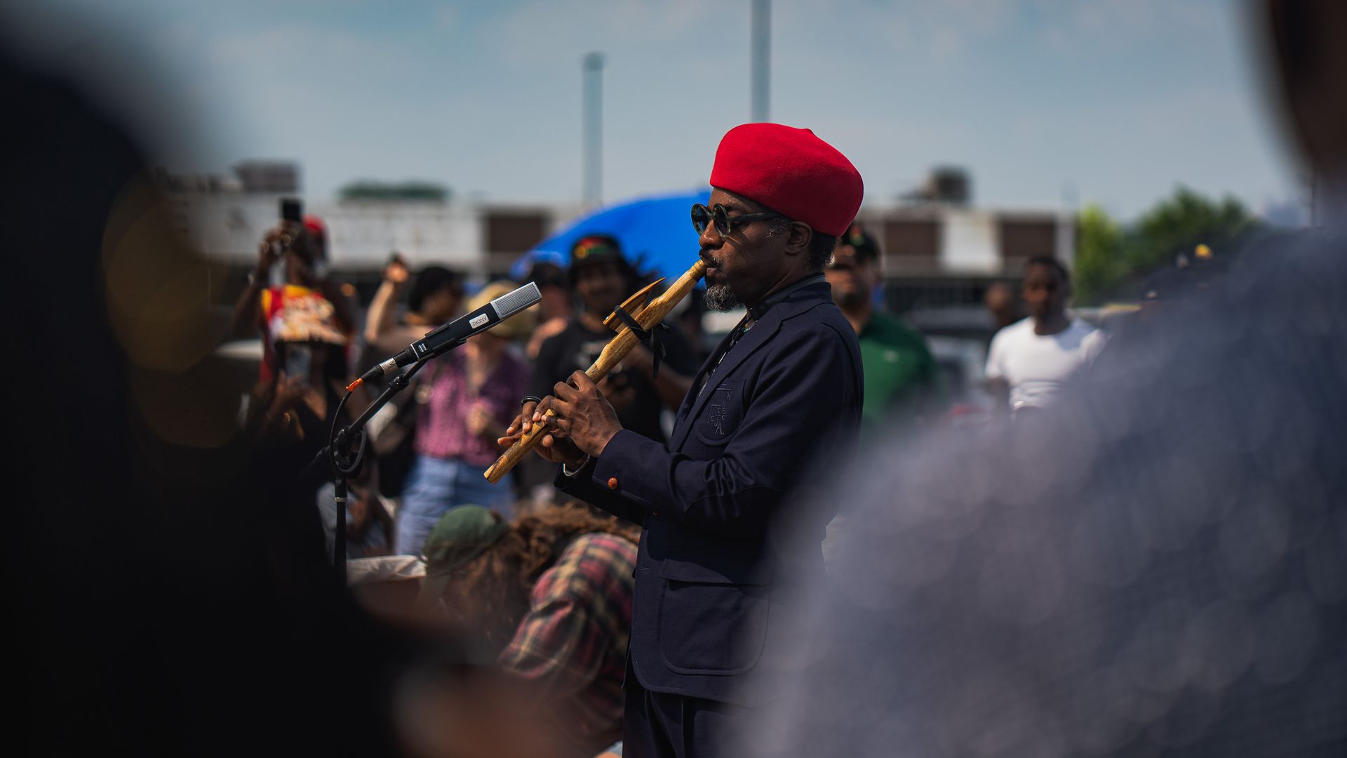 Andre 3000 plays the flute at a free, pop-up concert in Atlanta.