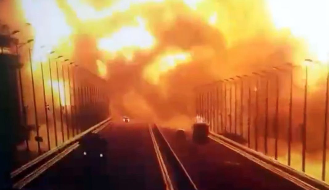 A screen grab from a surveillance footage shows flames and smoke rising up after an explosion at the Kerch bridge