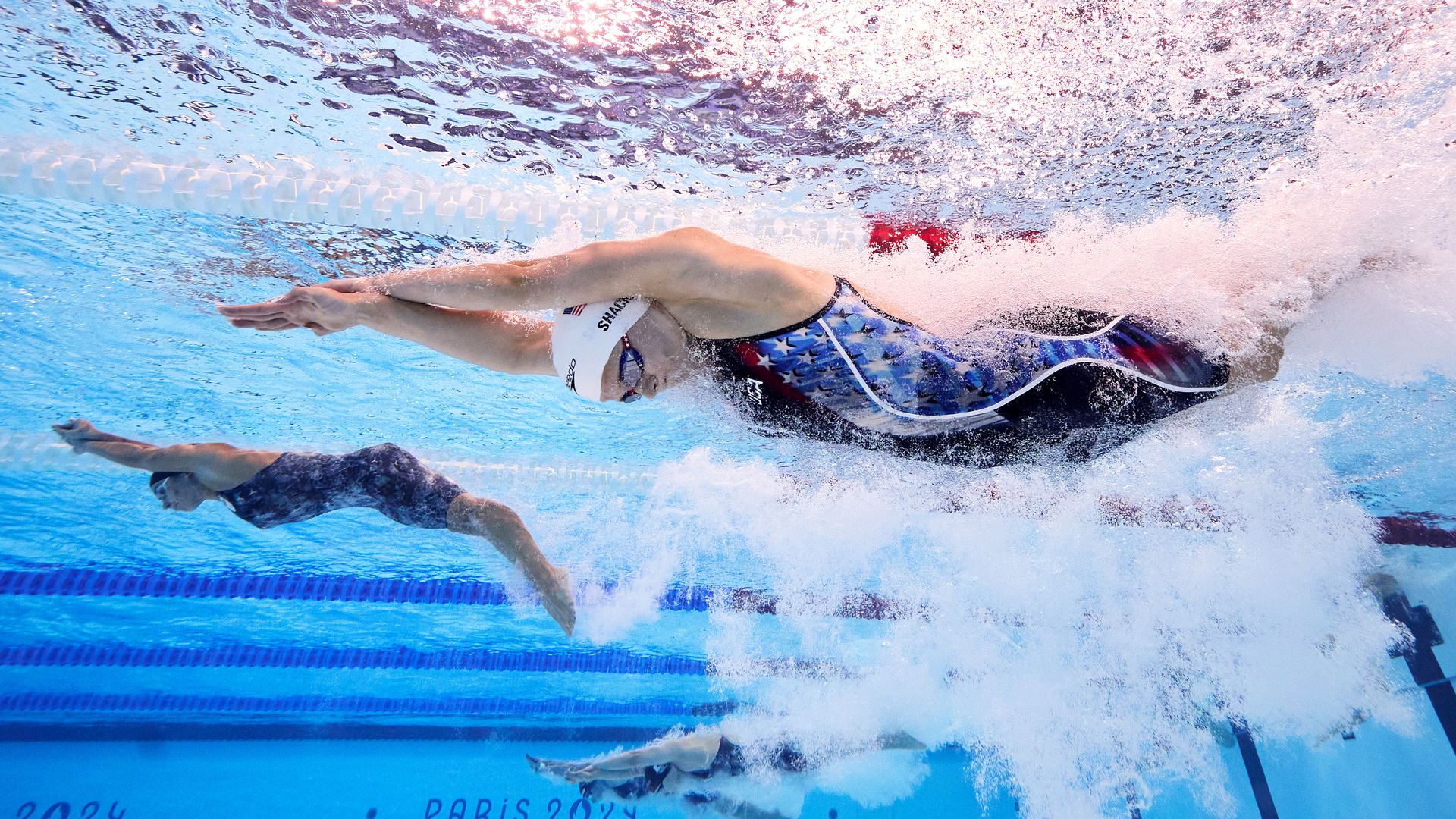 Alex Shackell of Team United States competes in the Women's 4x100m Medley Relay Heats on day eight of the Olympic Games Paris 2024 at Paris La Defense Arena.