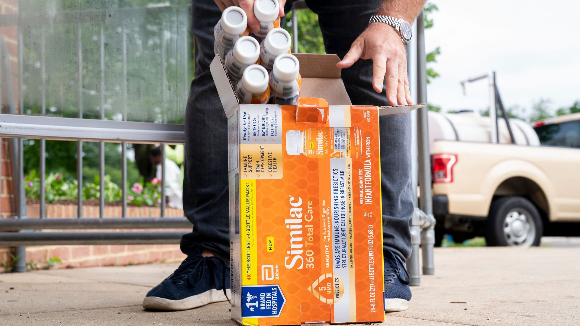 DC restaurateur Mark Bucher places baby formula into a fridge.