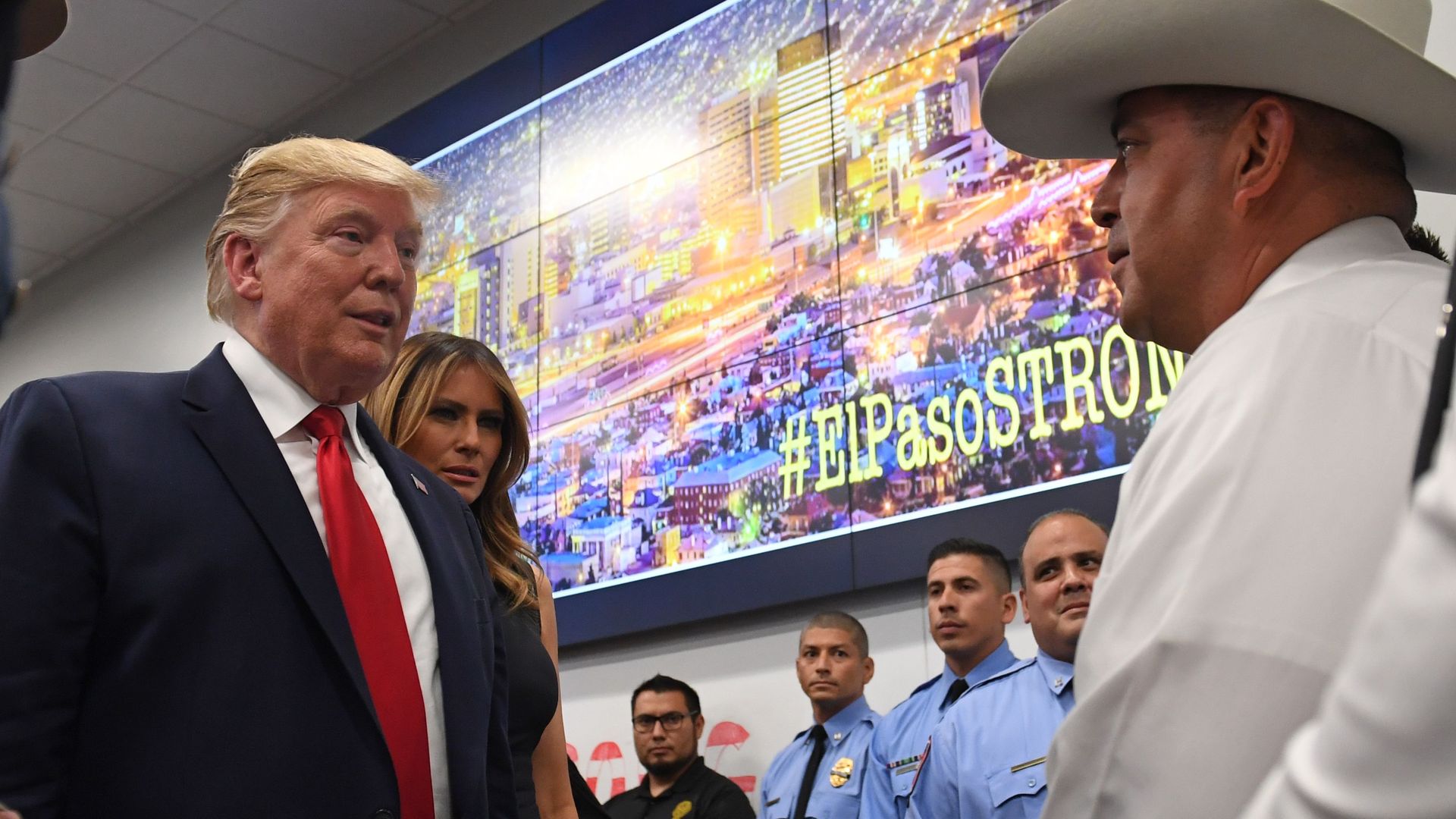 US President Donald Trump and First Lady Melania Trump greet first responders as he visits El Paso Regional Communications Center in El Paso