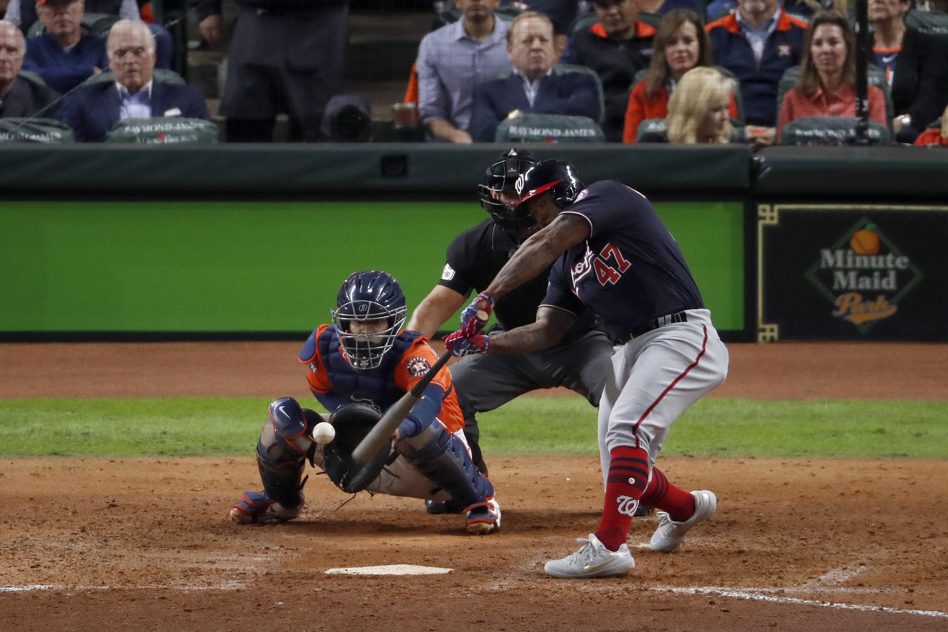Howie Kendrick #47 of the Washington Nationals hits a two-run home run against the Houston Astros during the seventh inning in Game Seven of the 2019 World Series