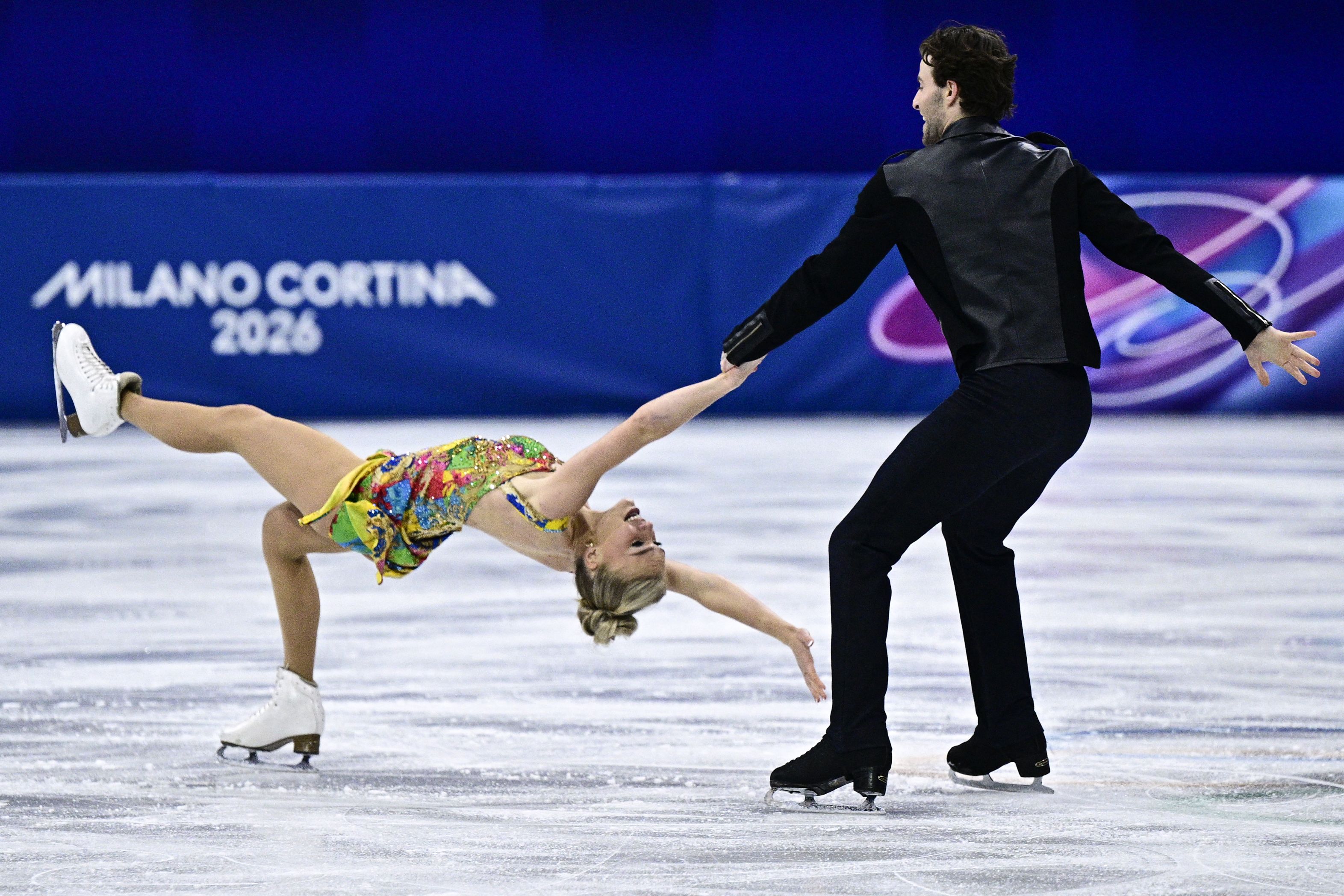Britain's Phebe Bekker and Britain's James Hernandez compete in the figure skating team event ice dance-rhythm dance during the Milano Cortina 2026 Winter Olympic Games at Milano Ice Skating Arena in Milan on February 9, 2025