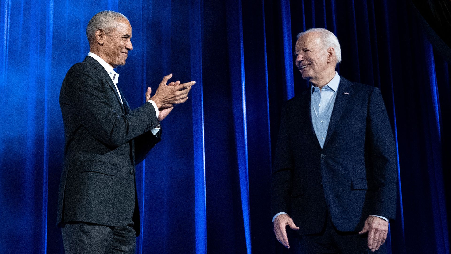  Former  President Obama claps for President Biden during a campaign fundraising event in New York City on Thursday. 