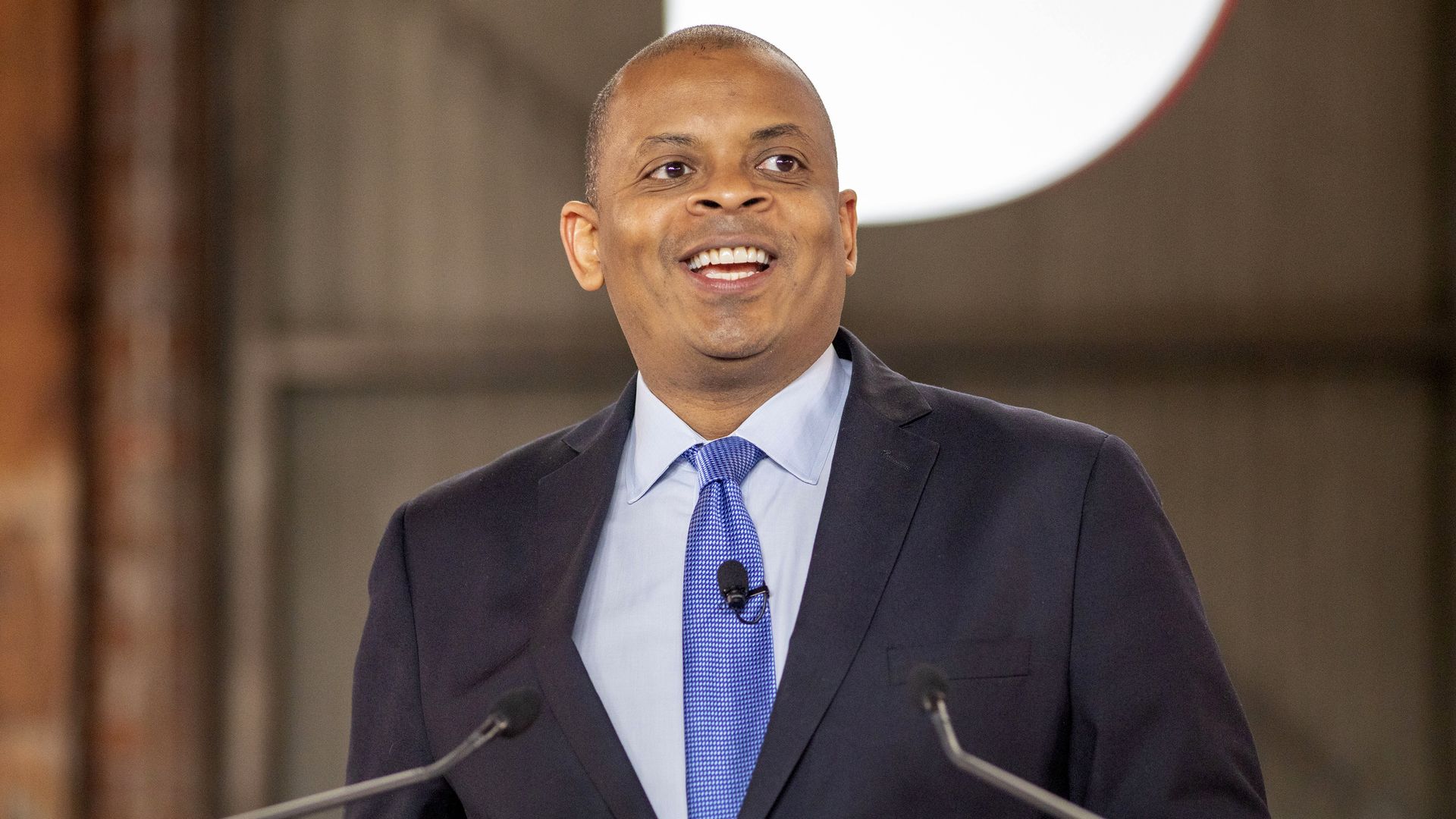Anthony Foxx is seen at a lectern.