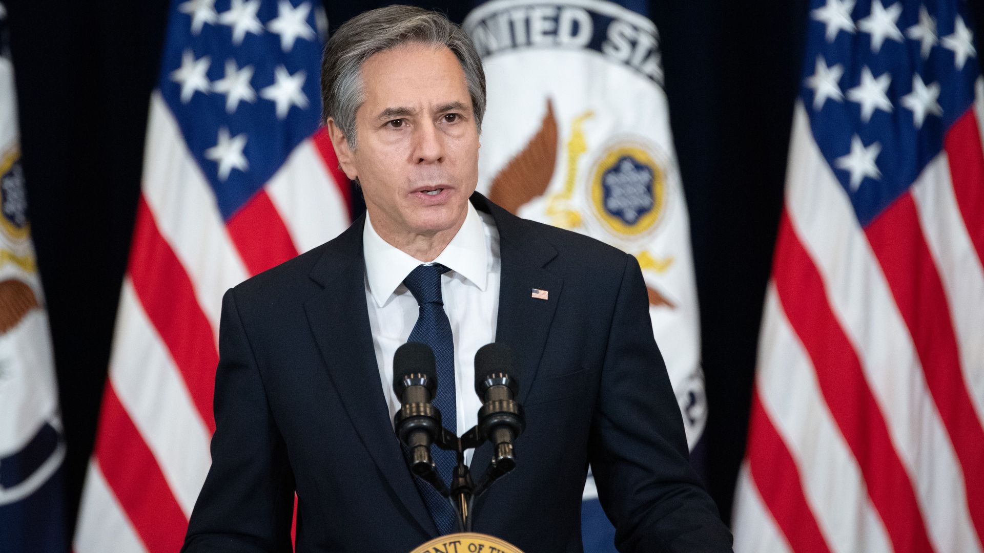 Anthony Blinken at the state department podium.