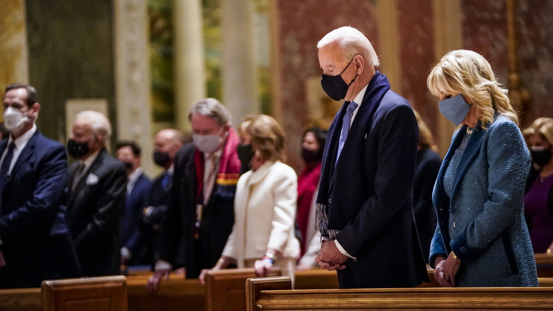Photo of Joe and Jill Biden praying in formalwear in a church pew