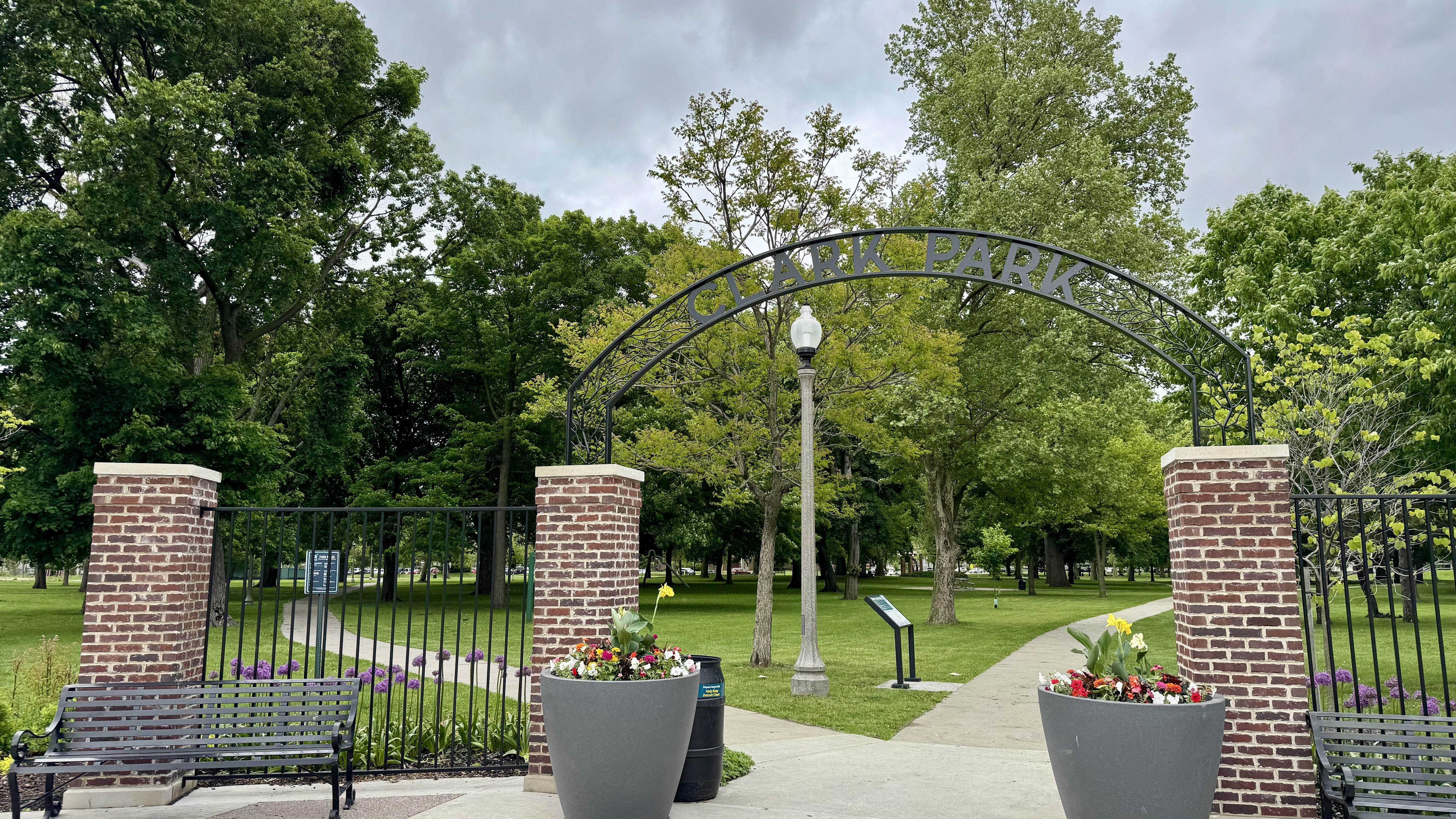The gate to clark park, blooming with flowers
