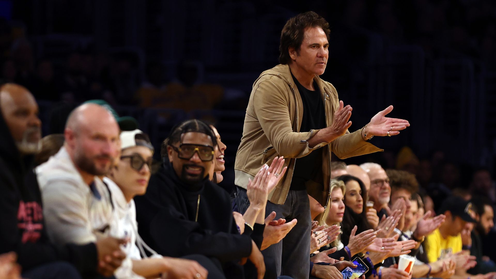 Pistons owner Tom Gores reacts to a play during Tuesday's game against the Los Angeles Lakers at Crypto.com Arena.