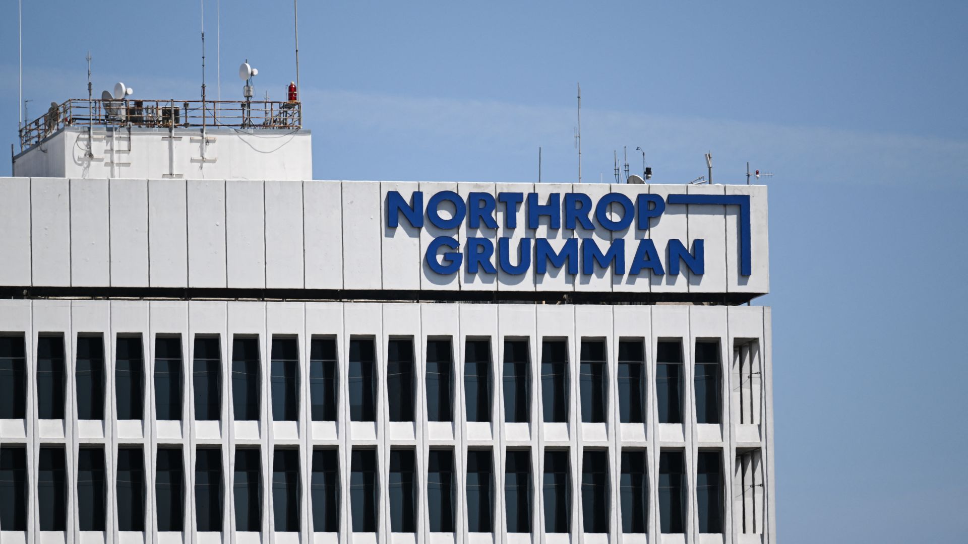 White office building with a bold blue sign reading "NORTHROP GRUMMAN" atop.
