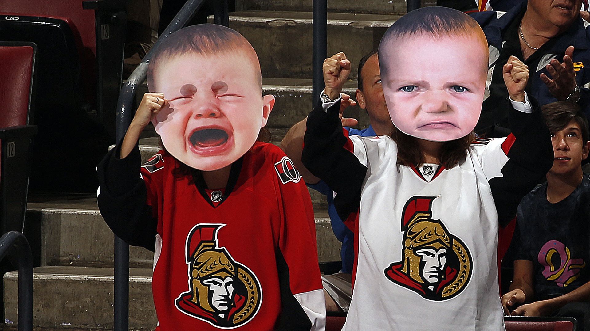 Senators fans wearing crying baby face masks