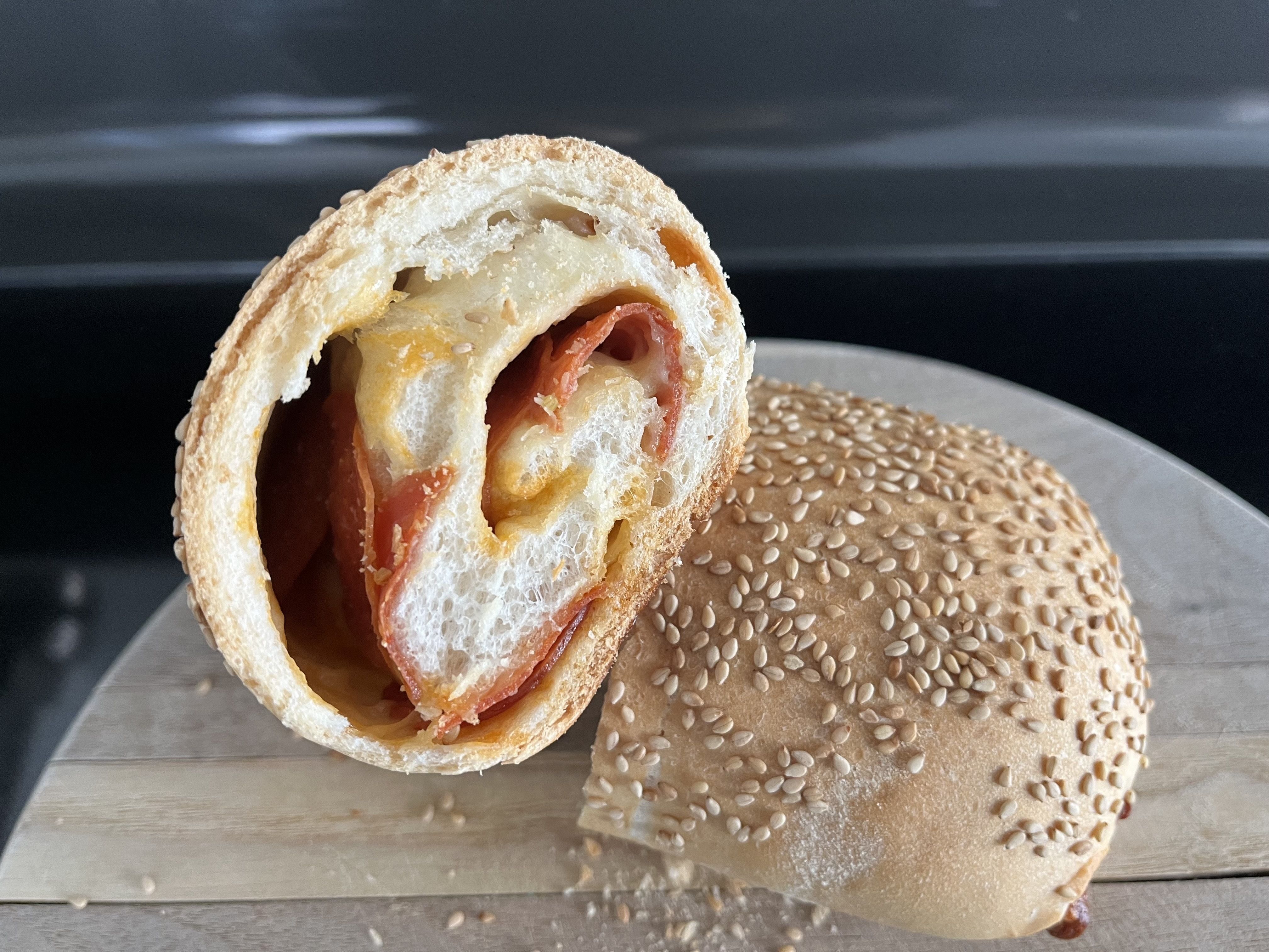Pepperoni rolls shown cut in half.