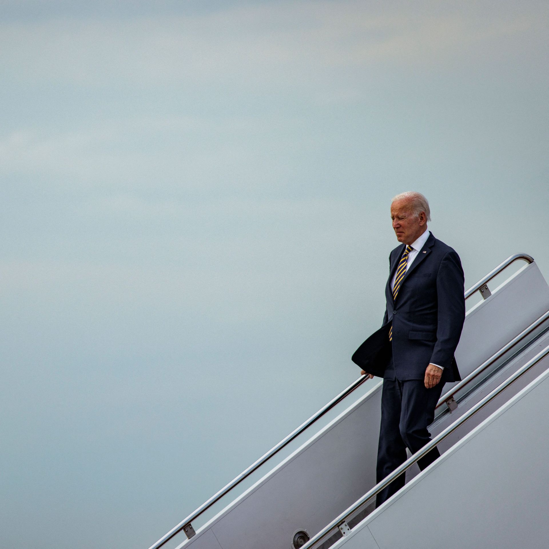 Biden walks down steps from Air Force One