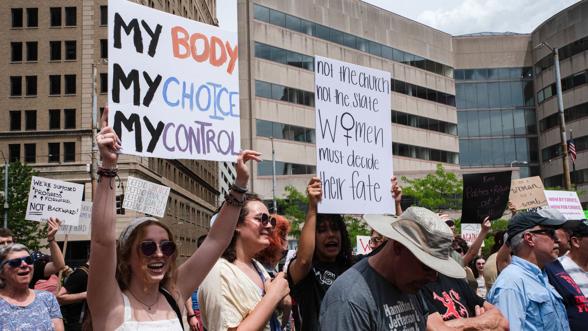 Pro-choice protesters in Ohio holding signs.