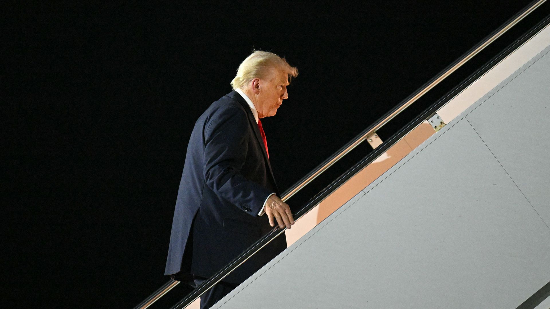  US President Donald Trump boards Air Force One at Naval Air Station Joint Reserve Base New Orleans in Louisiana on February 9, 2025, as he returns to Washington, DC, after attending Super Bowl LIX.