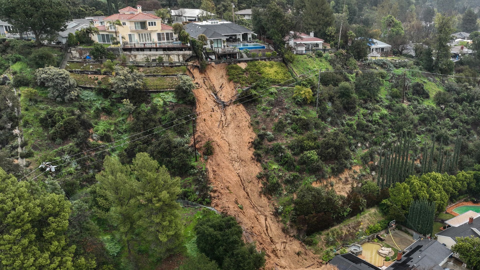 An aerial view of landslide damage that yellow-tagged two homesafter a mudslide crashed down in La Canada Flintridge Monday, Feb. 27.