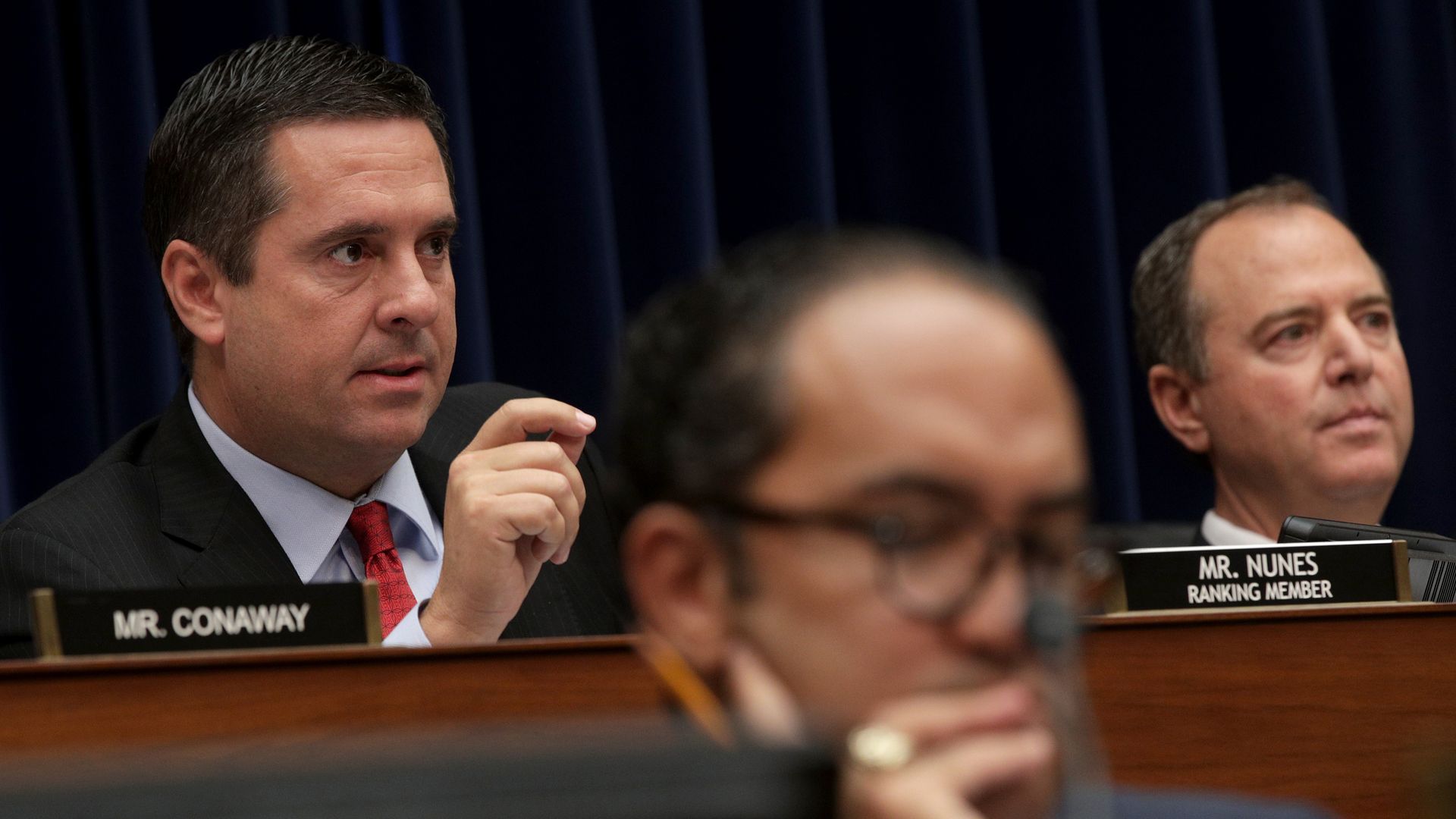 House Intelligence Committee ranking member Devin Nunes and chairman Adam Schiff listen to testimony