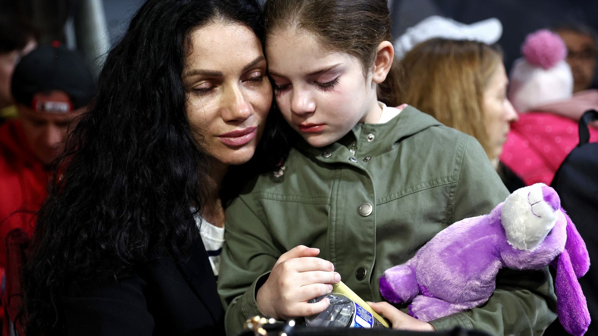 A Ukrainian mother and daughter, who are seeking asylum in the U.S., wait to cross the border to the U.S. in March from Mexico.