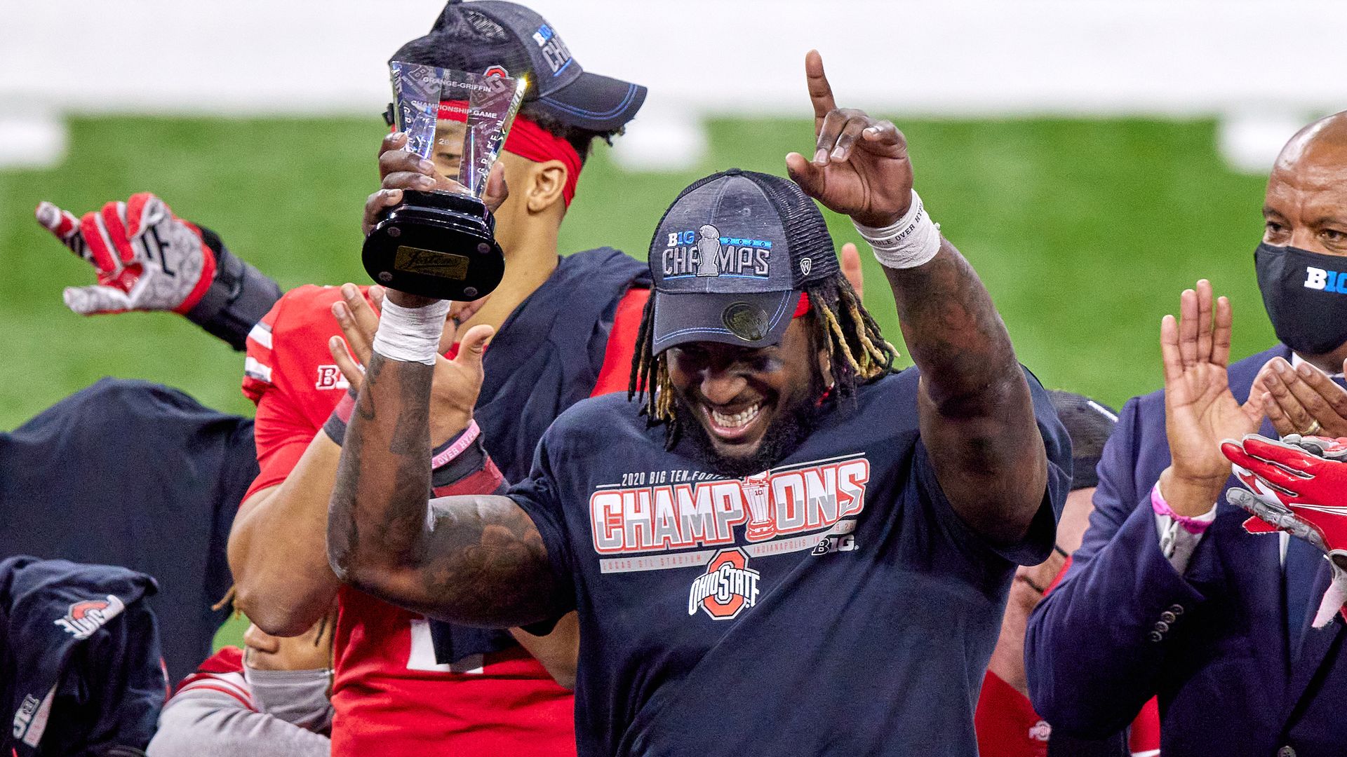 Ohio State running back Trey Sermon holds the Big Ten trophy after the 2020 conference title game. 
