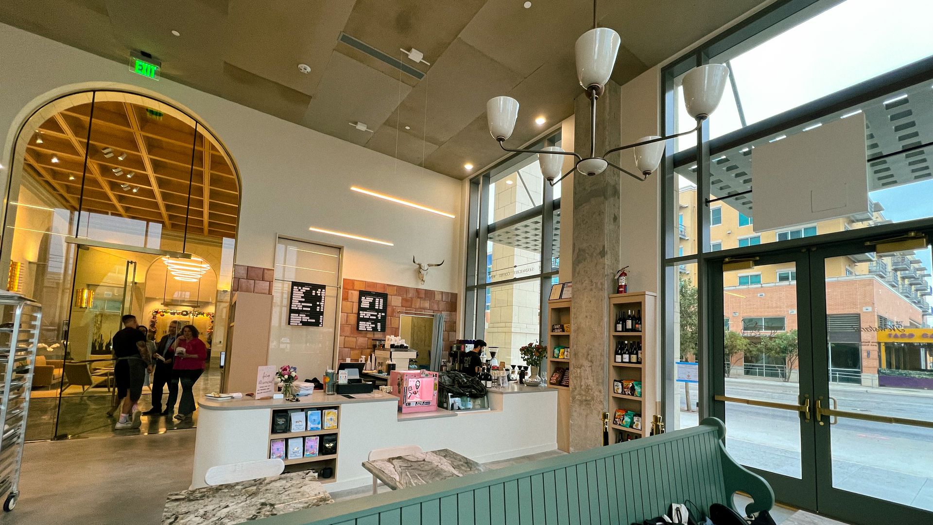 The interior of Newstand features high ceilings and warm tones. 