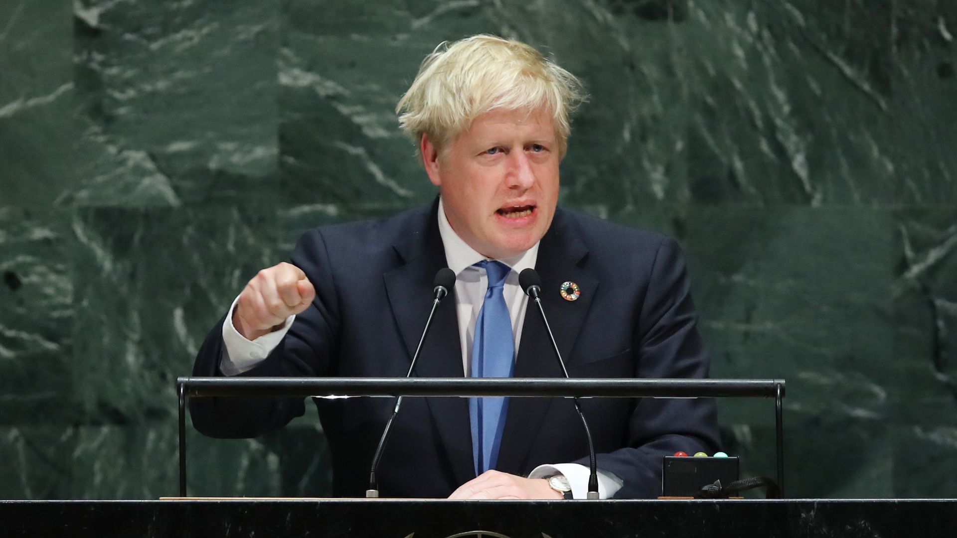 Johnson behind a podium