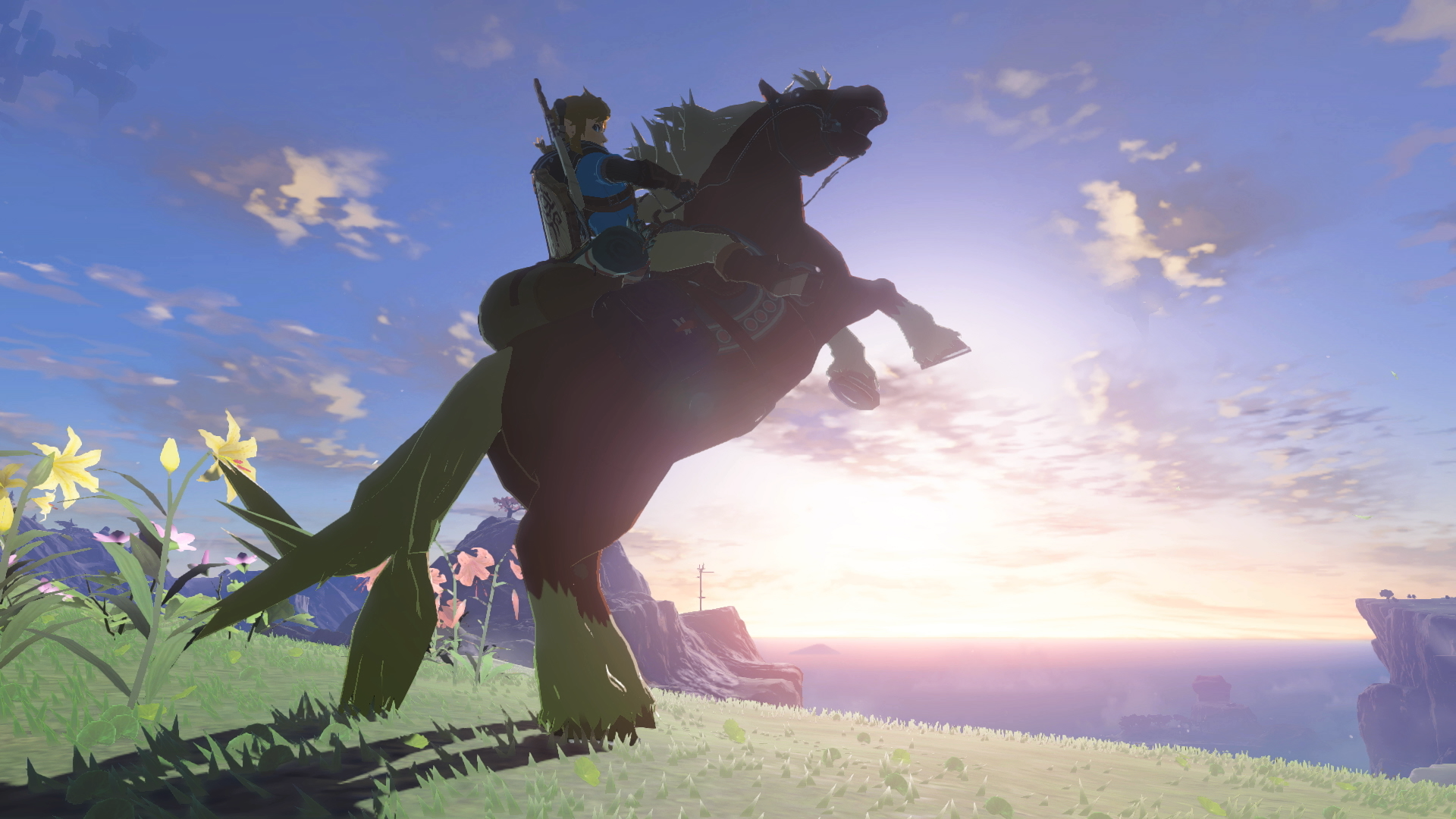 Video game screenshot of Link on a horse at sunset