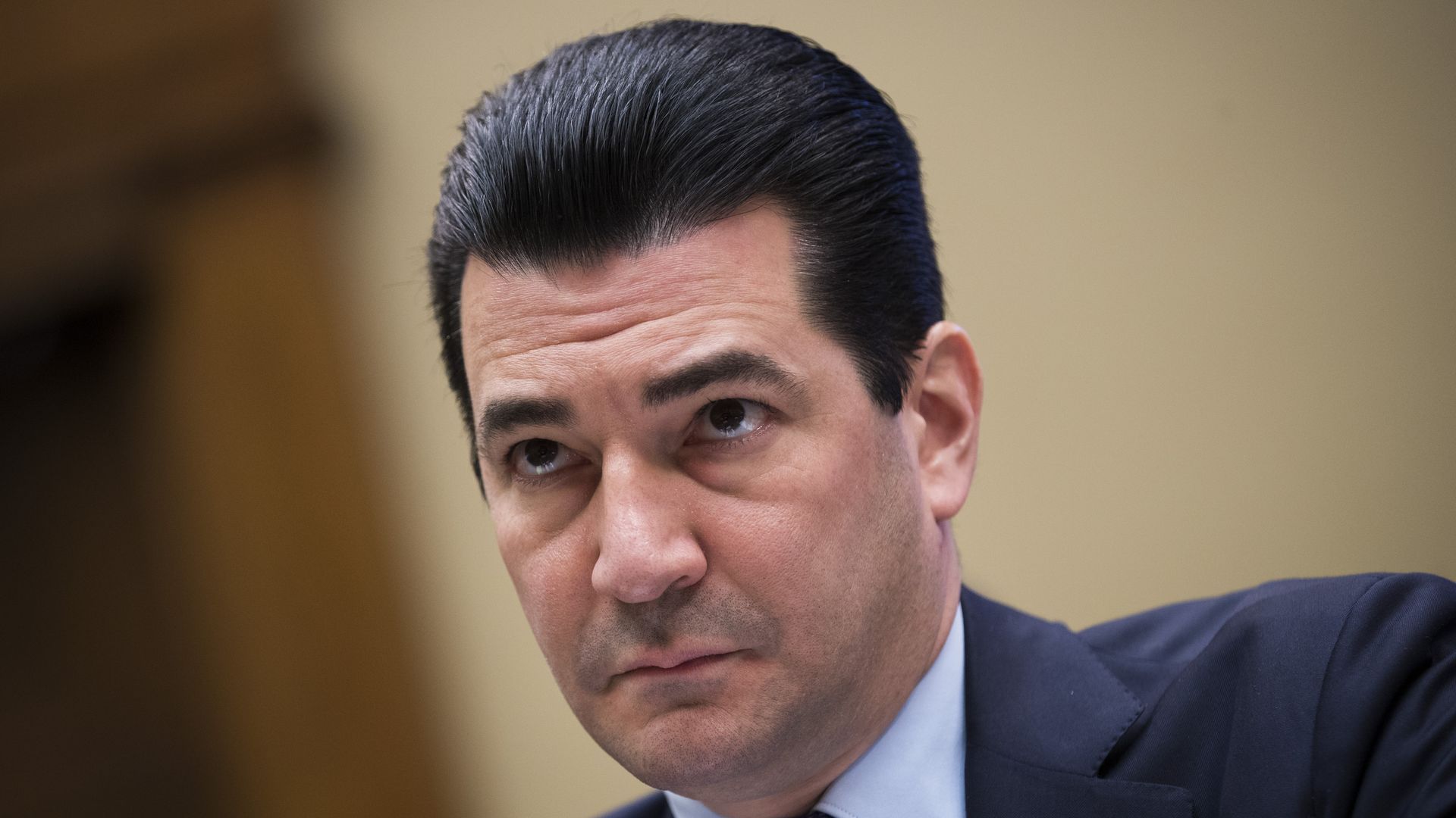 In this image, Scott Gottlieb looks ahead with a slightly concerned expression.