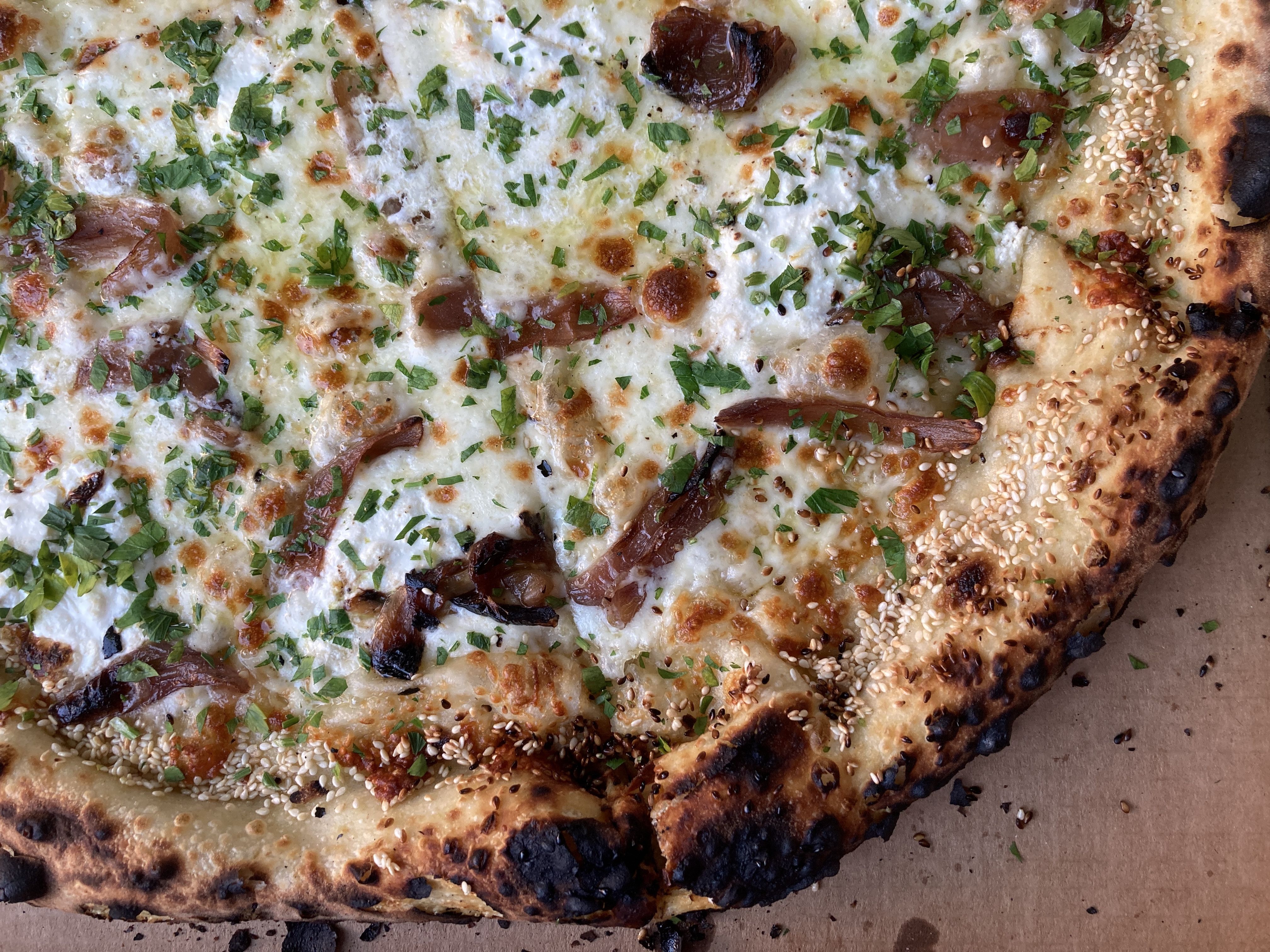 Close up of a pizza, including the crust.