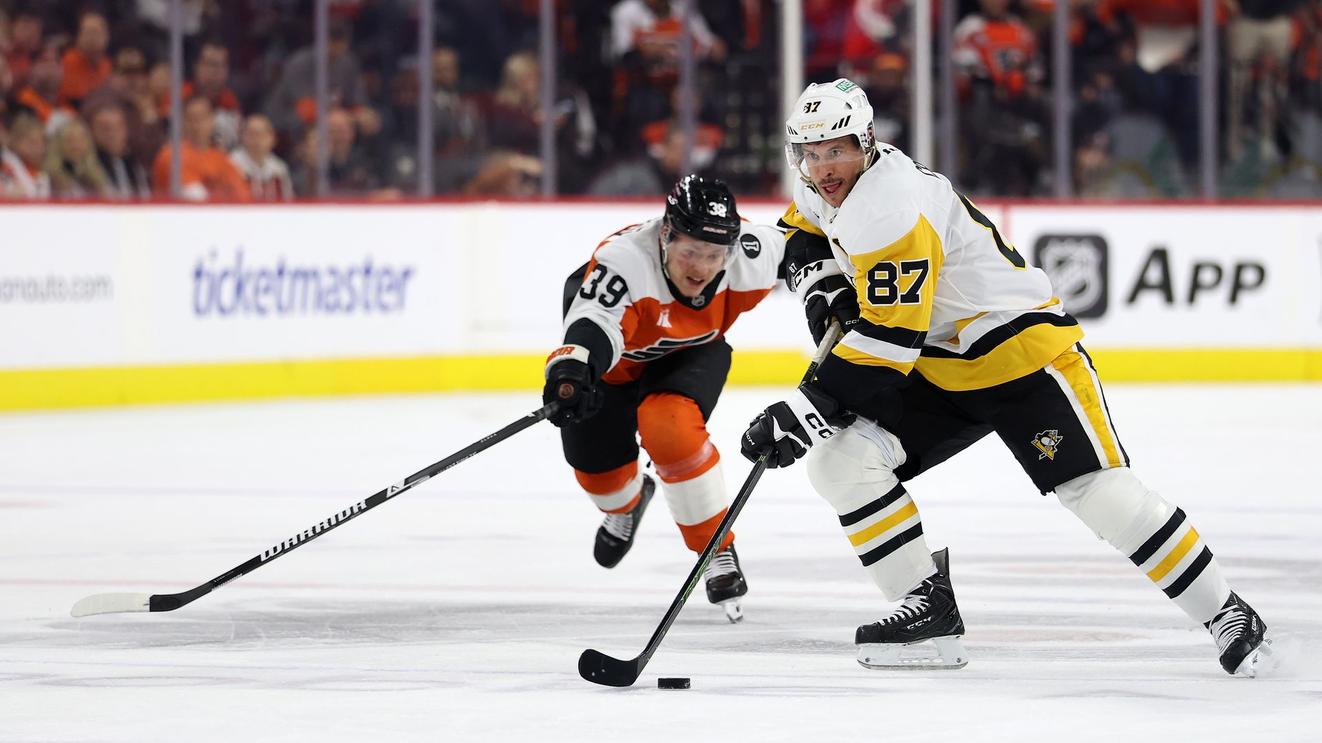 Sidney Crosby #87 of the Pittsburgh Penguins is pursued by Matvei Michkov #39 of the Philadelphia Flyers during the first period in Game Six of the First Round of the 2026 Stanley Cup Playoffs at Xfinity Mobile Arena on April 29, 2026 in Philadelphia.