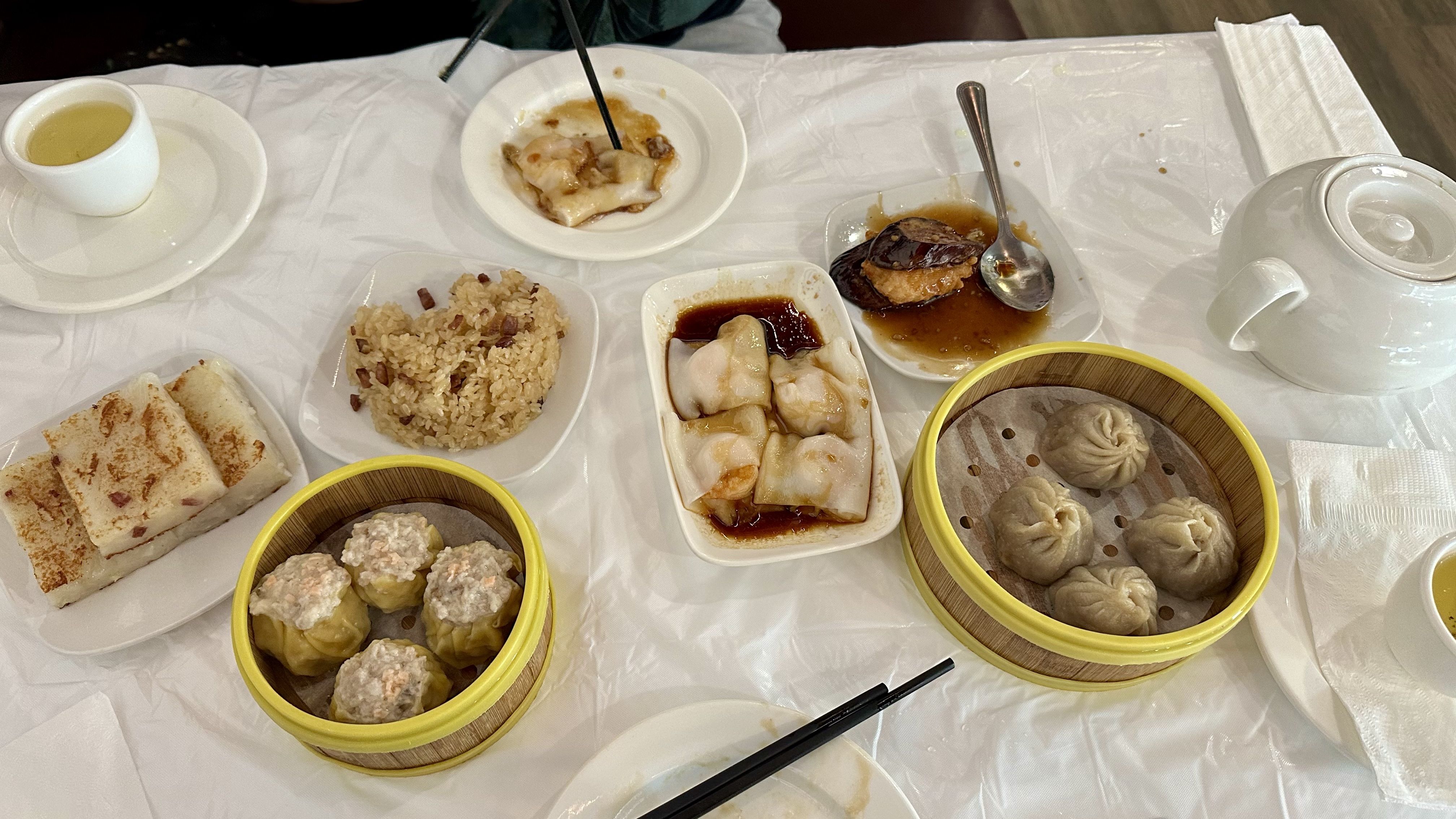 Photo shows dim sum and dumplings on the table.