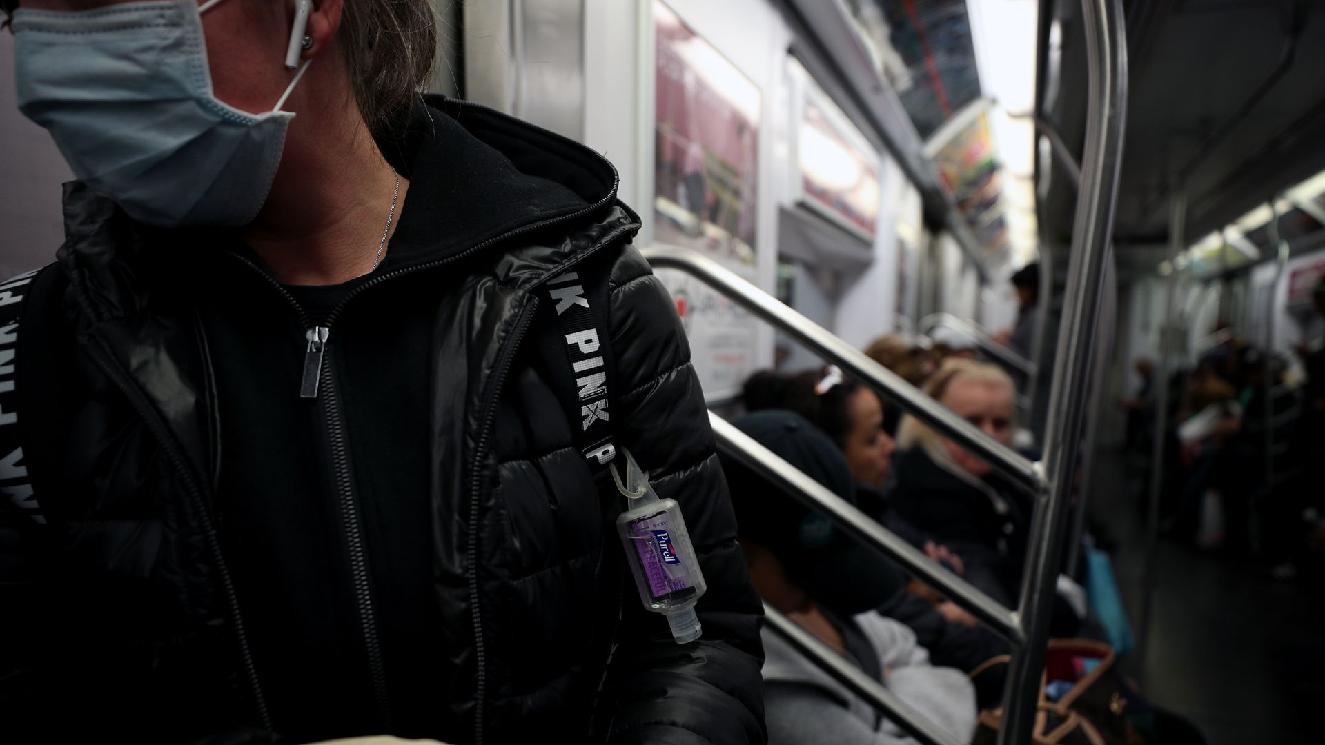 Woman wearing a face mask on the New York City subway
