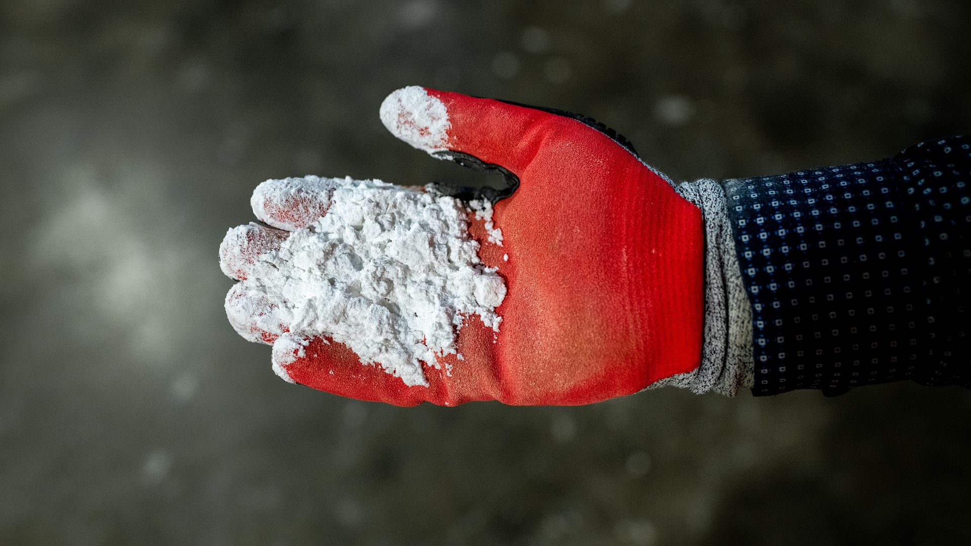 1 big thing: Companies target royalty rate for lithium  VISUAL: Getty …. A worker holds lithium hydroxide at a plant in Chile. Photo: Cristobal Olivares/Bloomberg via Getty Images