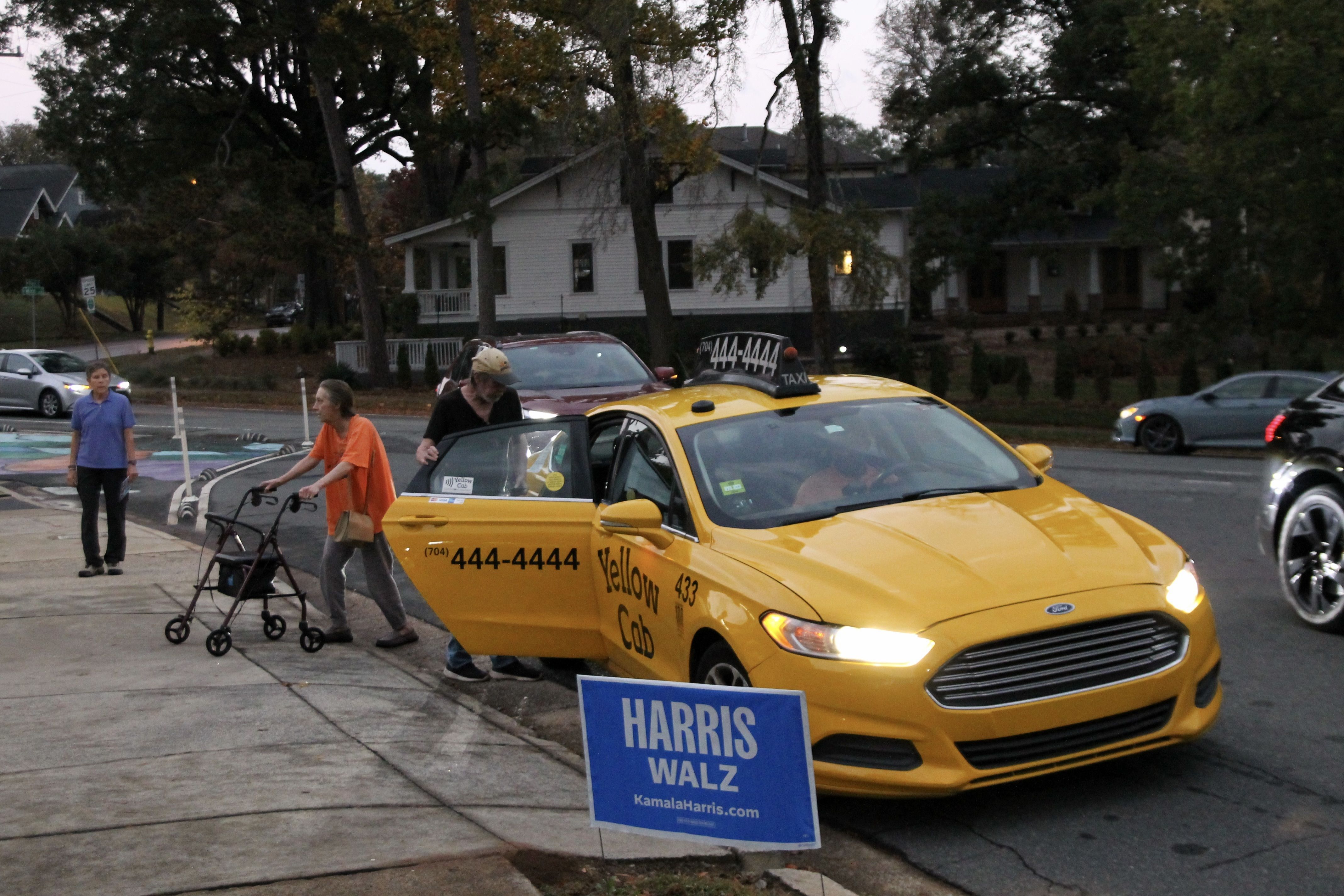 taxicab drops a voter off at the polls in Charlotte