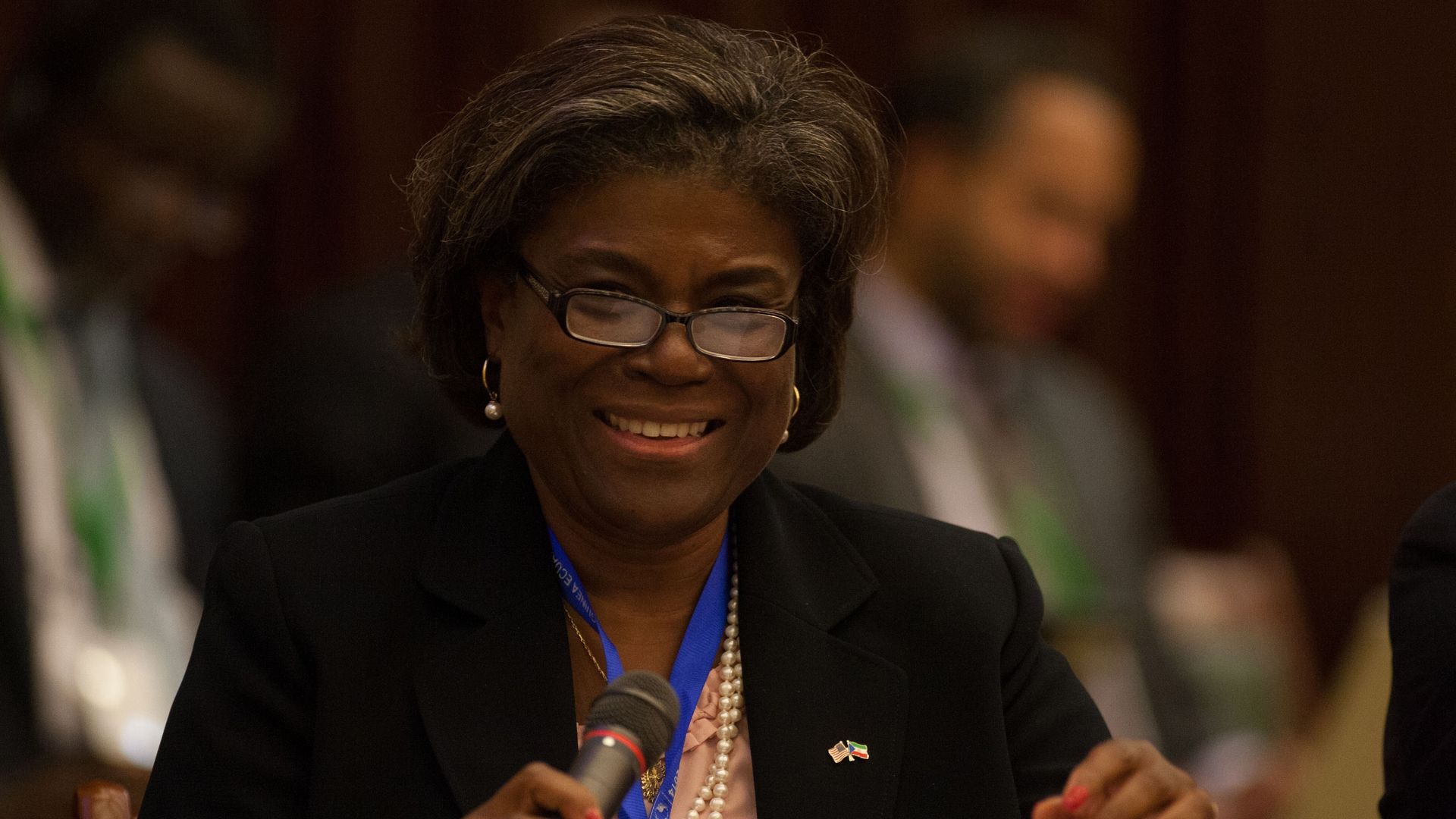 Linda Thomas-Greenfield holds a microphone 