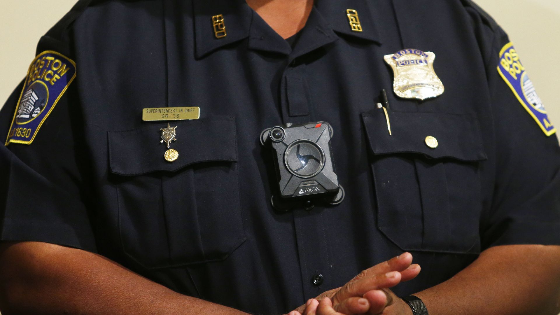 Picture of the torso of a police officer with a body camera attached