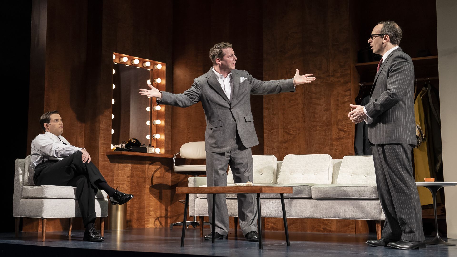 Photo of actors on stage in a play. 