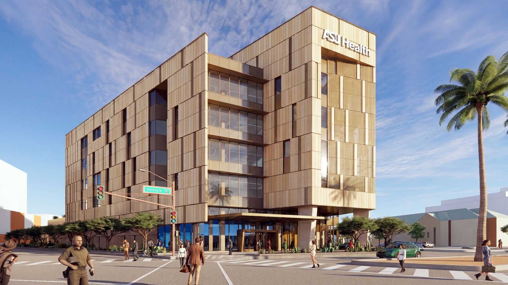 Modern beige building with ASU Health sign rises at a busy street corner, with a glass entrance, palm trees on the right, pedestrians, and a Fillmore street sign under a blue sky.