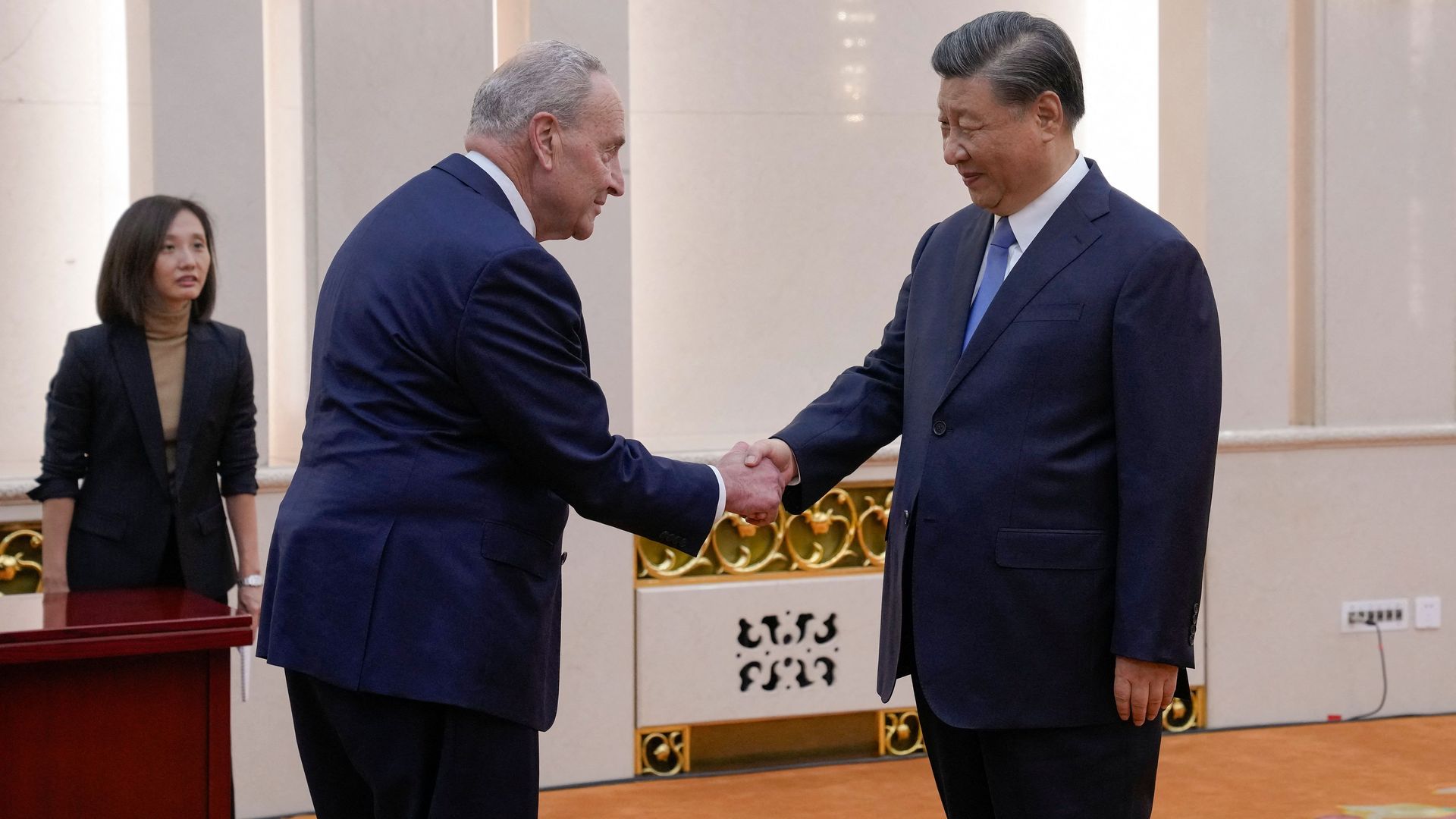 Senate Majority Leader Chuck Schumer (D-N.Y.) shaking hands with Chinese President Xi Jinping in Beijing on Oct. 9.