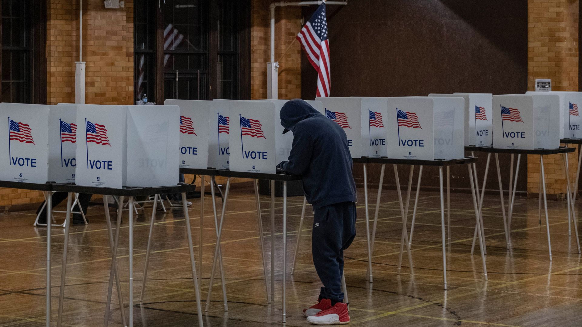  A resident casts his vote on November 3, 2020, at Berston Fieldhouse in Flint, Michigan.