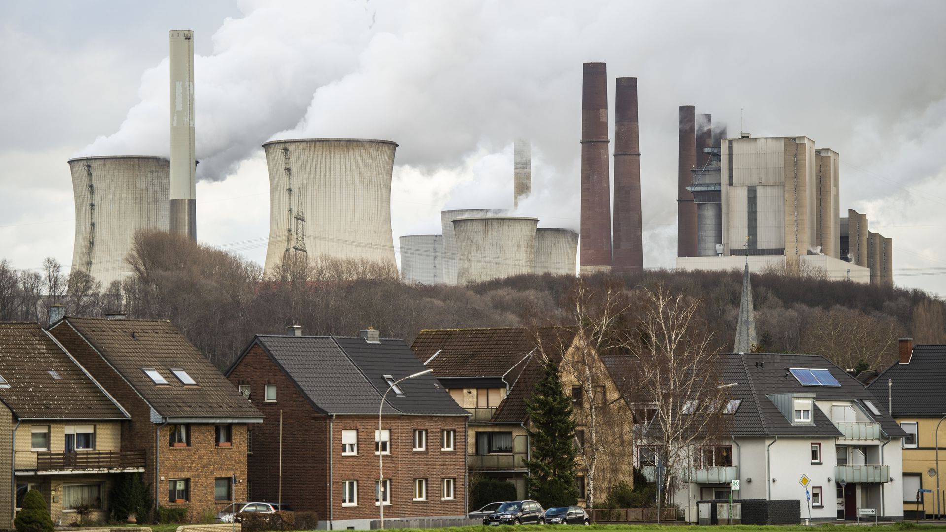 Photo of steam rising from the cooling towers of the Neurath lignite-fired power plant in Germany