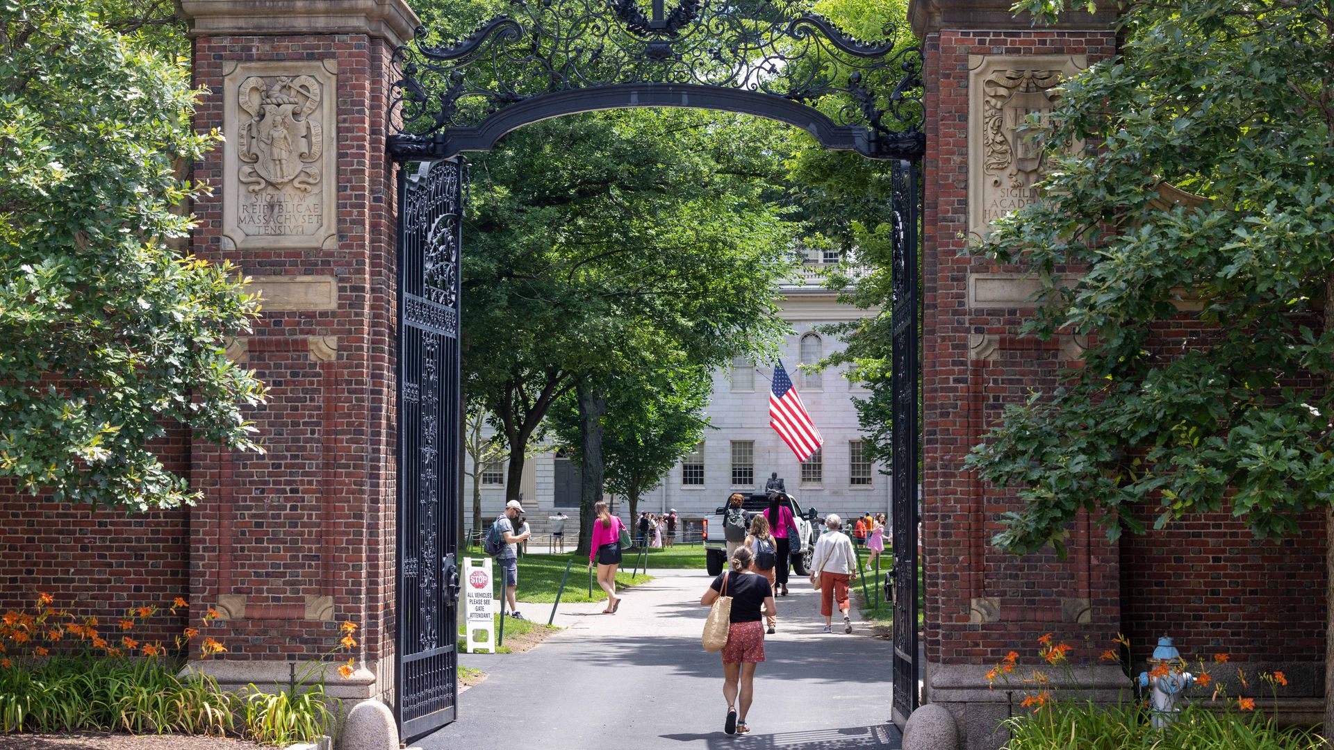  People walk through the gate on Harvard Yard at the Harvard University campus on June 29, 2023 in Cambridge, Massachusetts. 