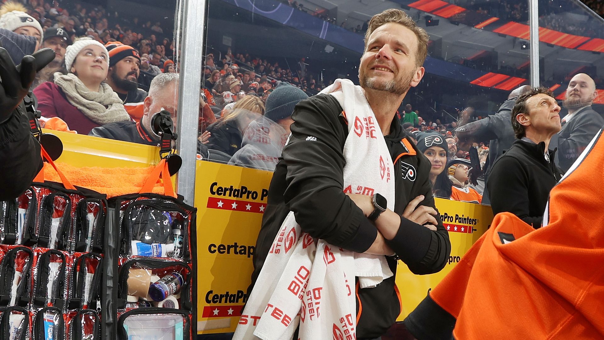 Flyers head equipment manager Rick Bronwell with a towel draped over his shoulder during a game. 