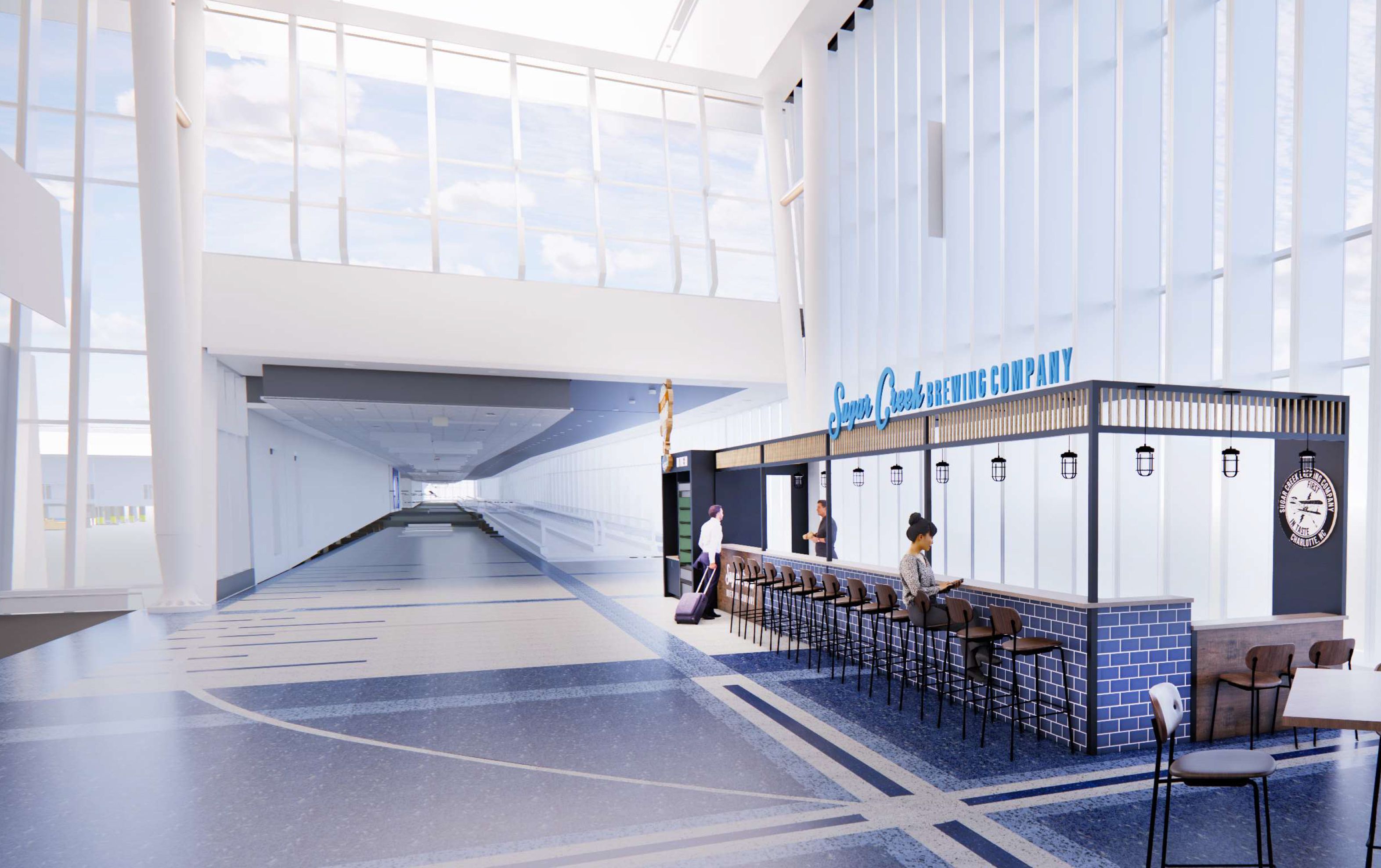 Modern indoor airport area with large windows, blue and white tiled floor, and a bar named Sugar Creek Brewing Company with people sitting and standing nearby.