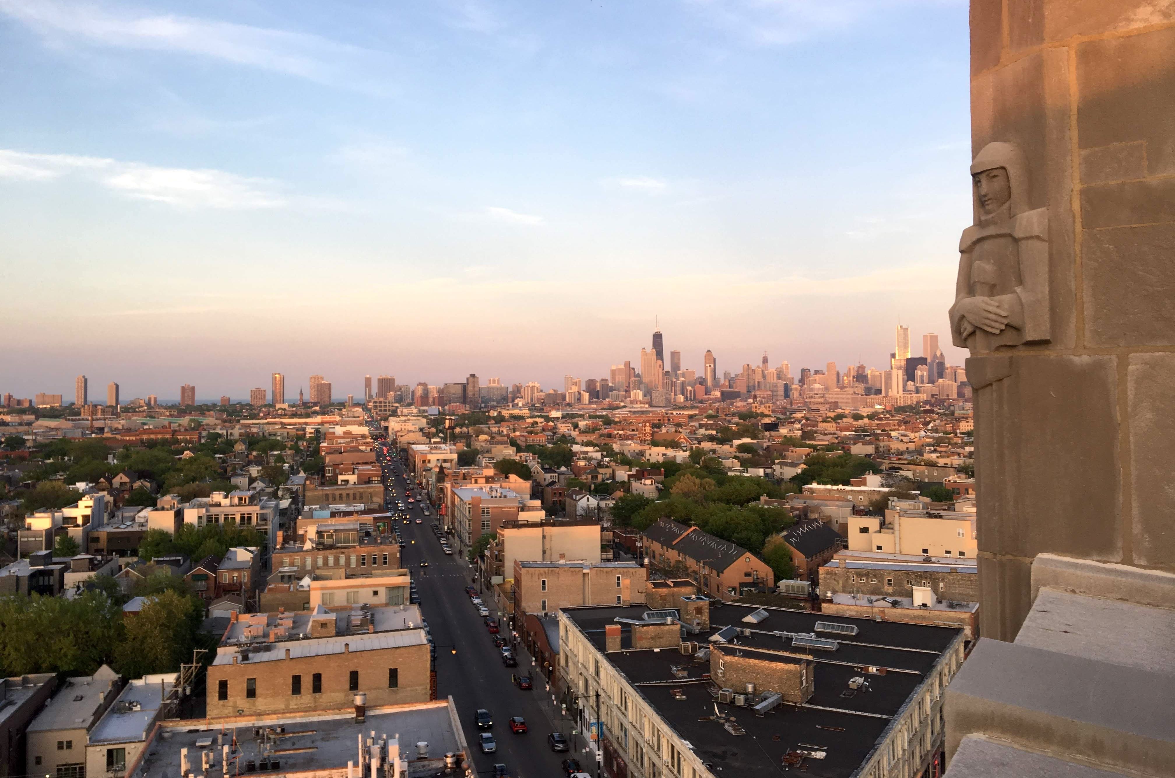 Rooftop view of city with Chicago skyline in background.