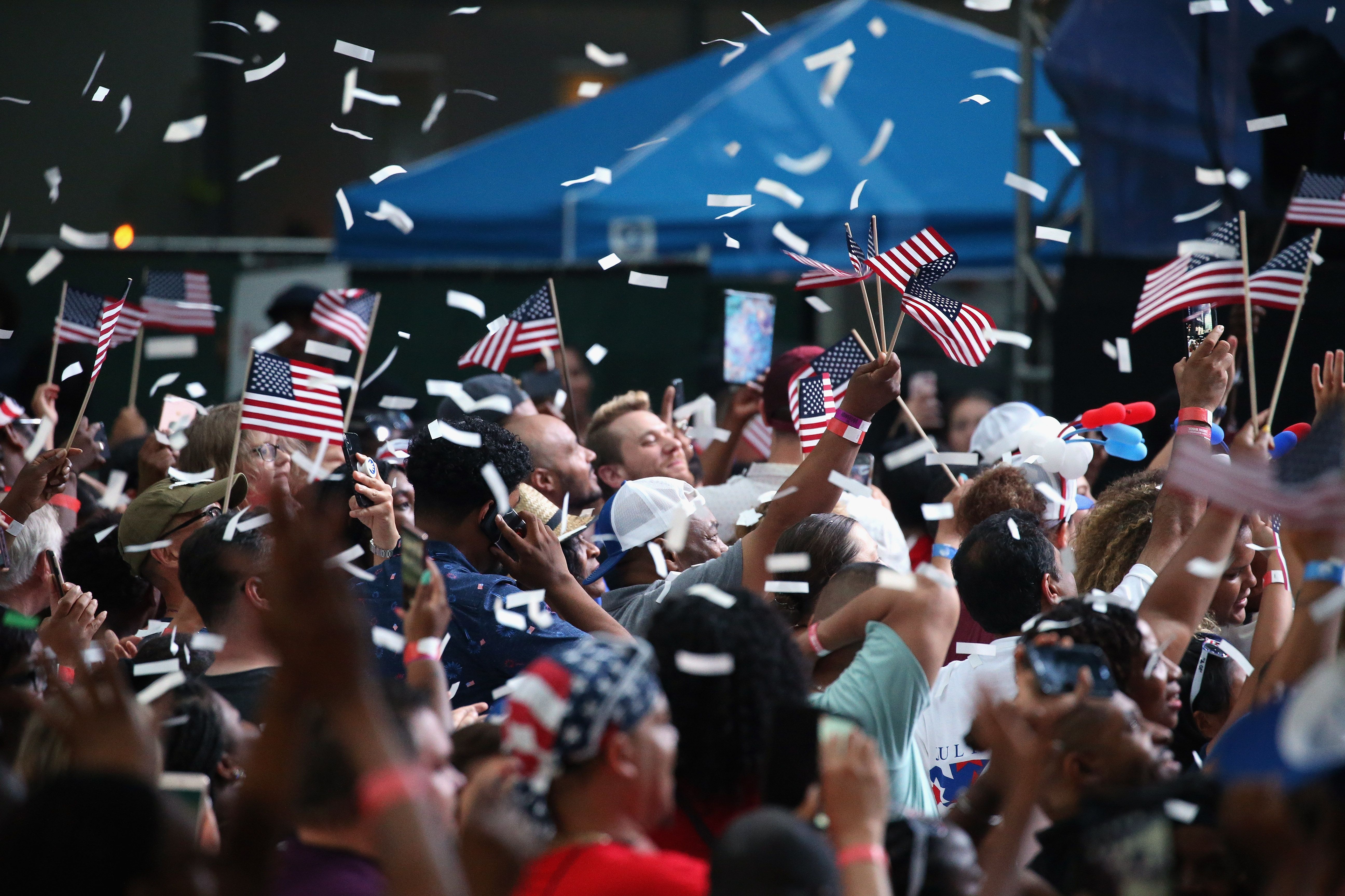 Confetti falls onto a crowd celebrating the Fourth of July in 2019.