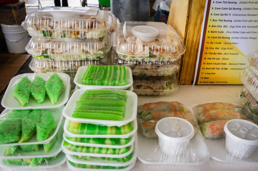 Photo shows green pandan treats and other Vietnamese food