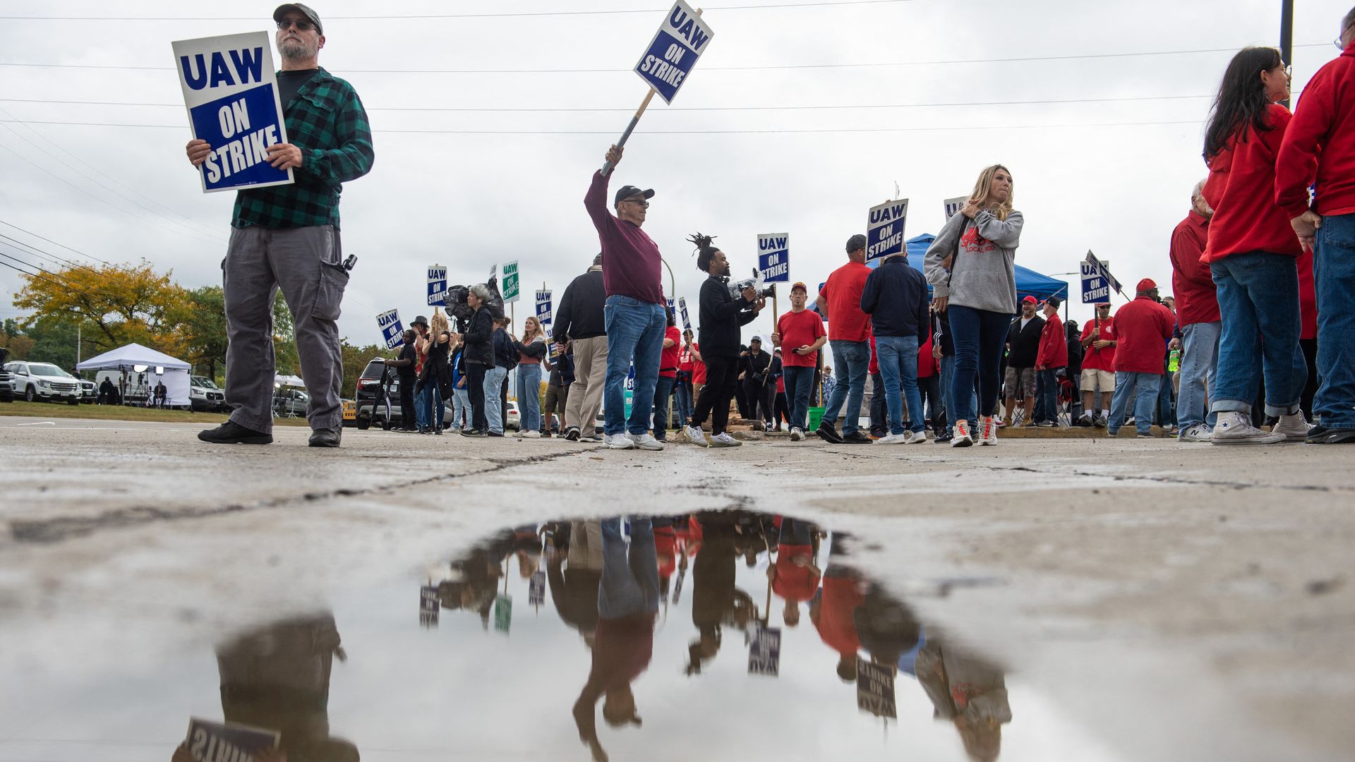 UAW workers striking with signs.