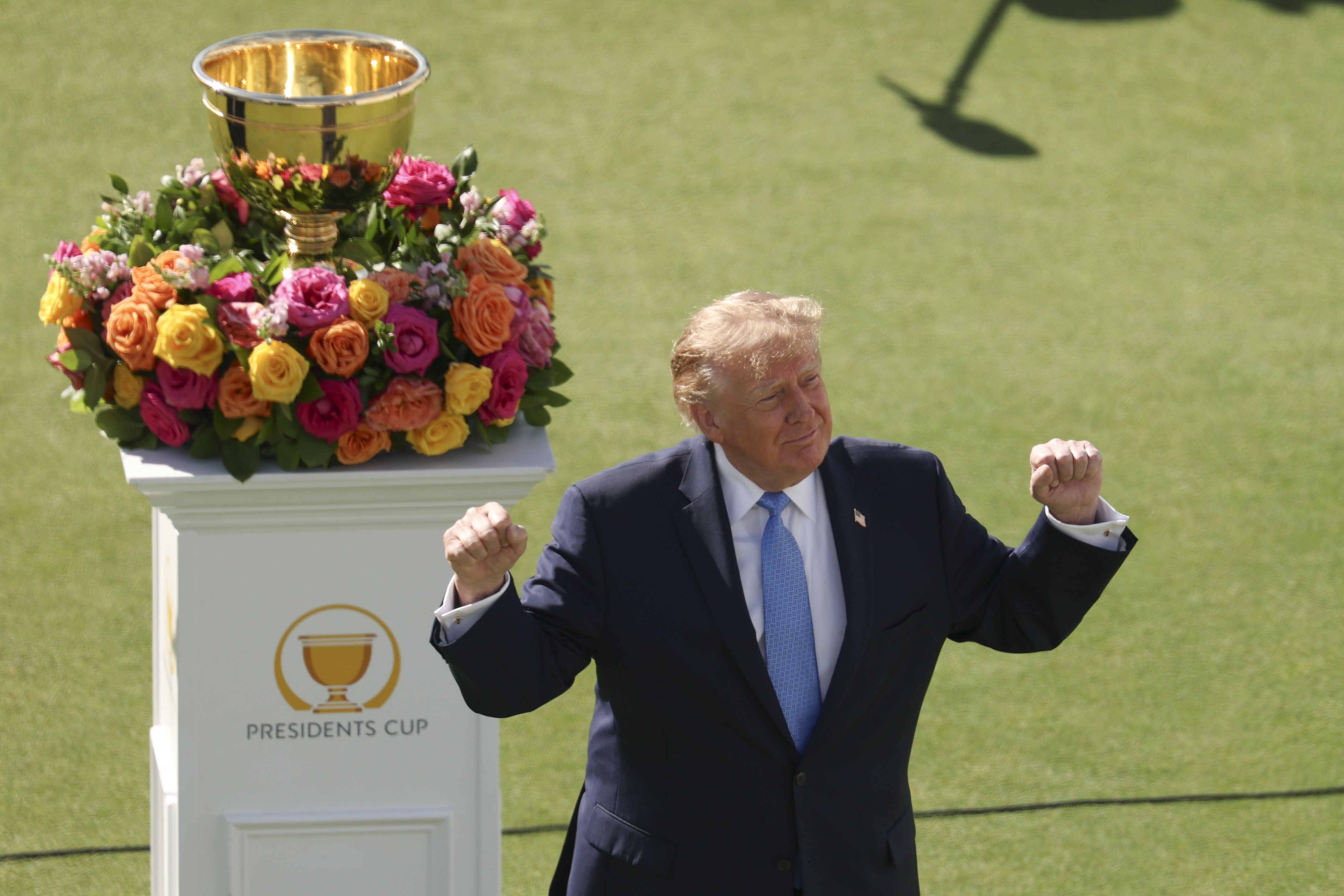 . President Donald Trump cheers on the first tee with the trophy during Sunday's Singles on day four of the Presidents Cup 2026 at Medinah Country Club on September 27, 2026 in Medinah, Illinois. (Photo by Luke Hales/Getty Images)