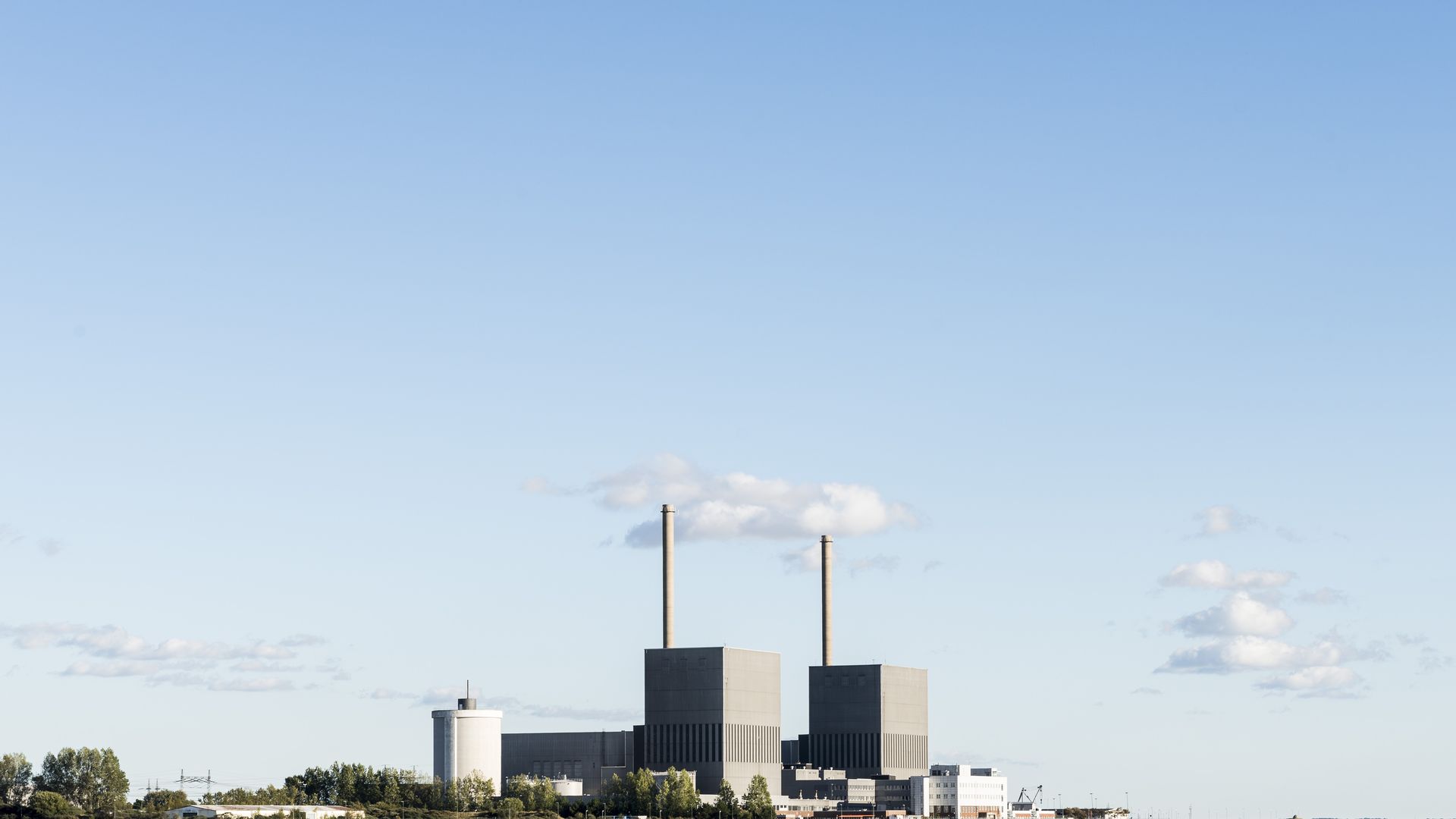 A nuclear power plant surrounded by water.